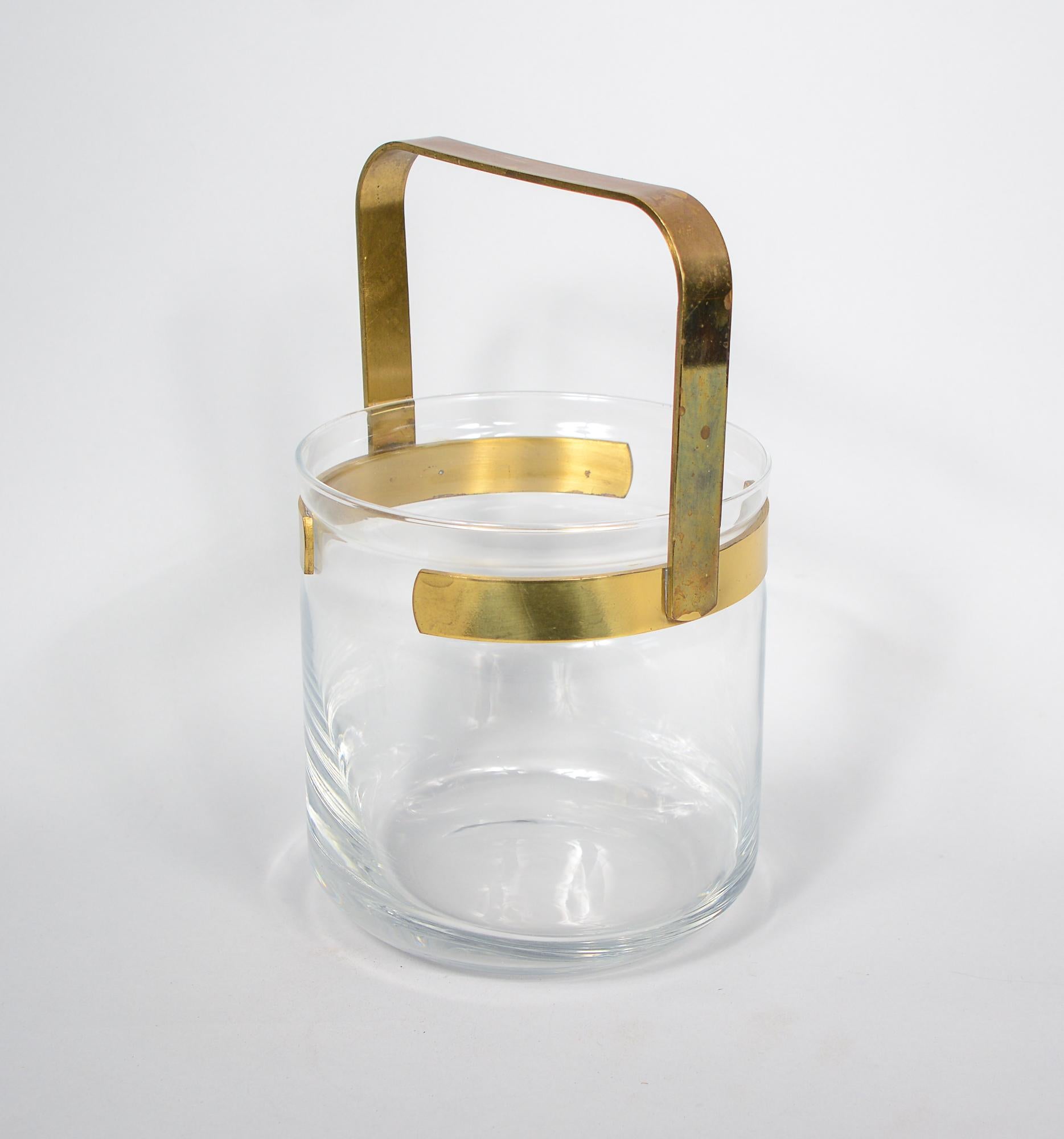 Brass and glass ice bucket with brass tongs. Well made design by P.M. Italy. This is in good condition. Some oxidation to the brass. 