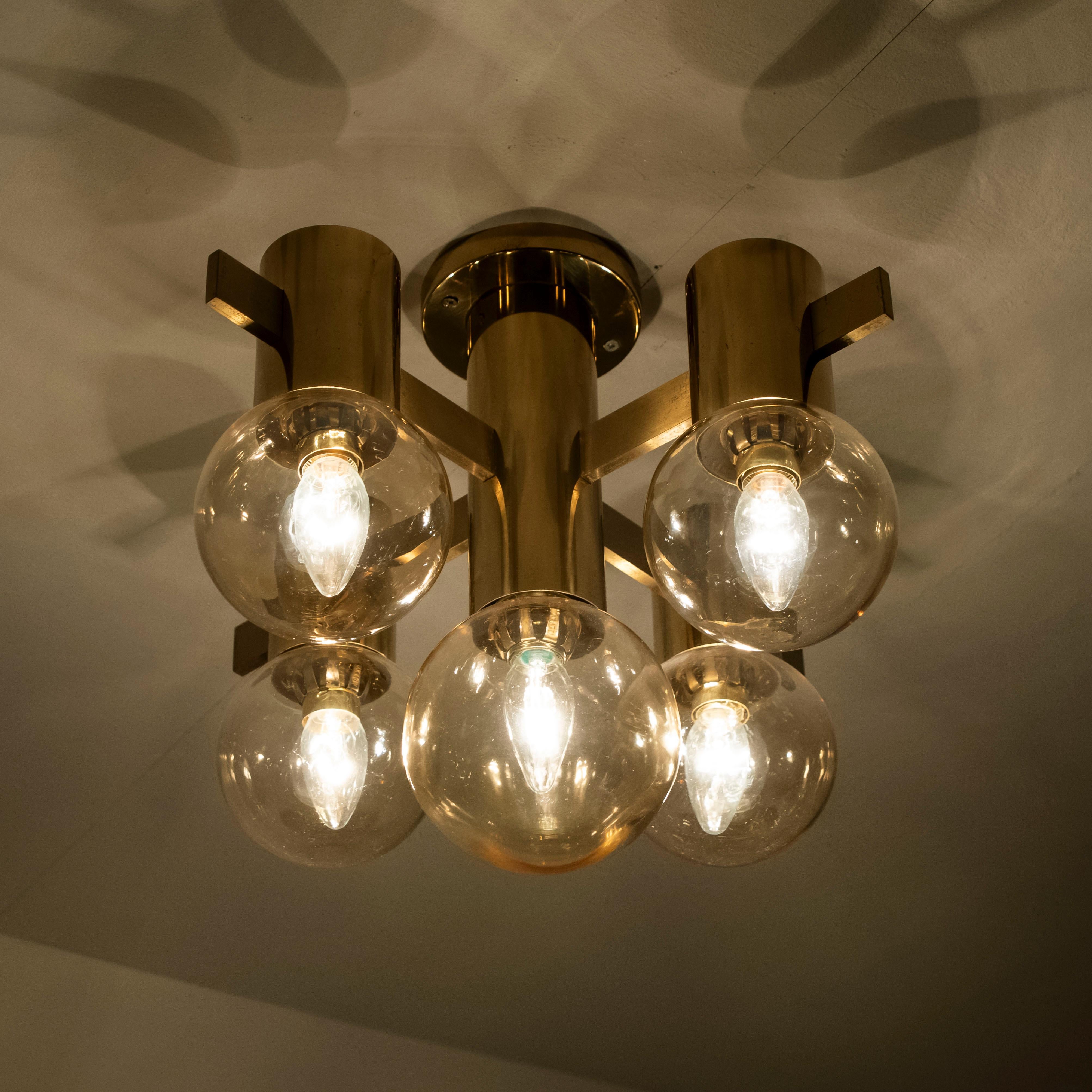 1 of the 3  brass light fixtures with smoked glass bowls and gold-plated fittings was produced in the 1970s in the style of Hans-Agne Jakobsson. Illuminates beautifully.

Size of the flush mount: 
Depth 13.8