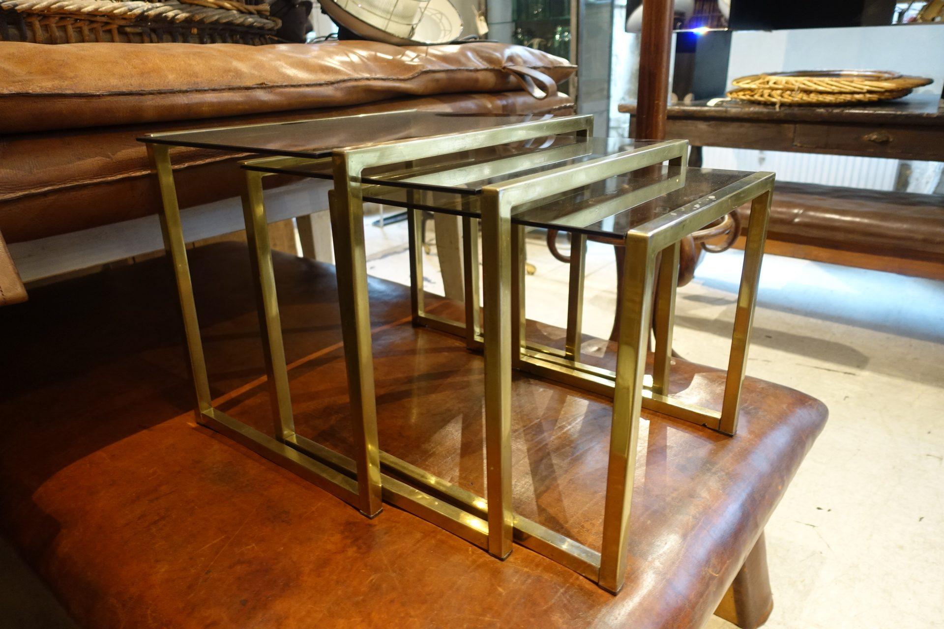 A stunning set of three elegant Italian insert tables, cubic formed, made of glossy quality and with pale smoked glass countertops. Sleek geometric form.

Stylish and particularly suitable for the interior of the living room, where they can be
