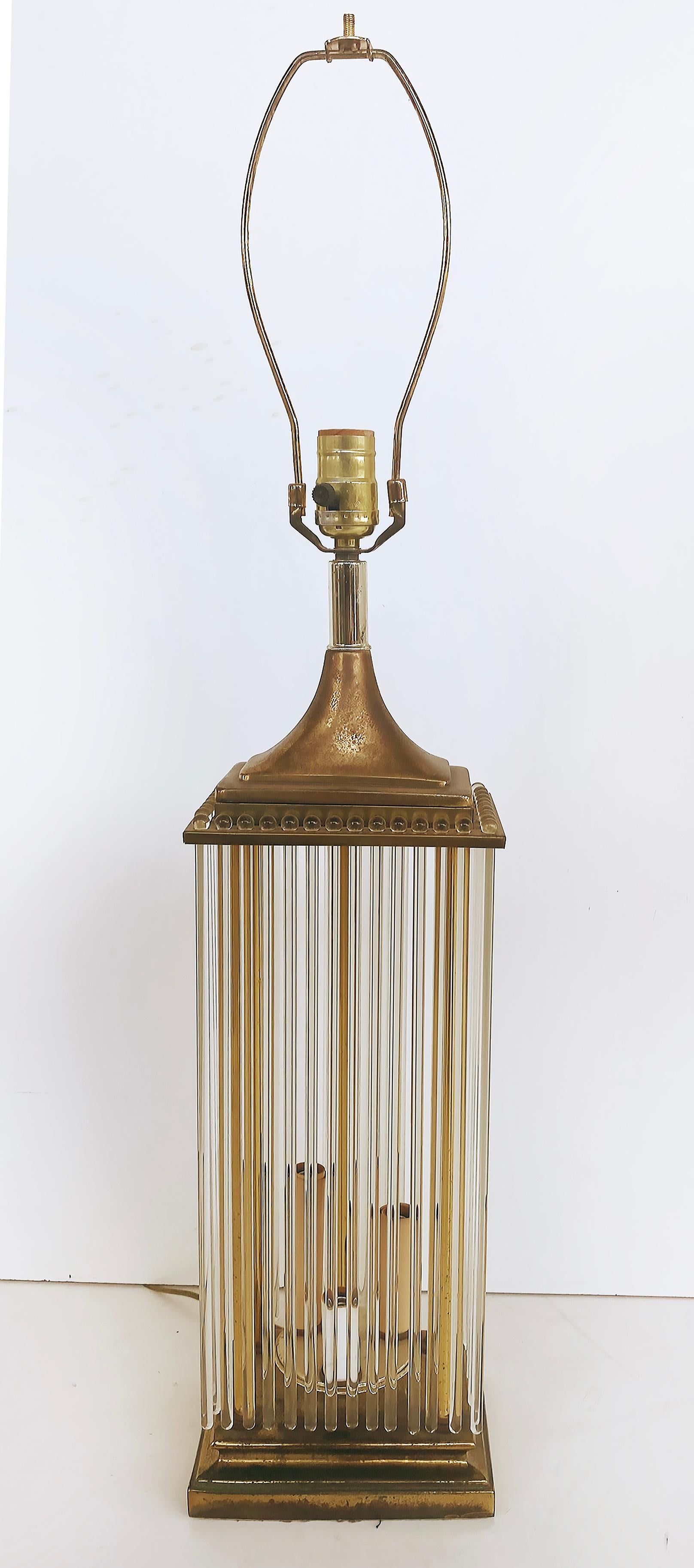 Brass and Glass Rod Table Lamps, Gaetano Sciolari Lightolier Attributed Pair

Offered for sale is a pair of brass and glass rod table lamps attributed to Gaetano Sciolari for Lightolier. The base lights up with 3 lower sockets that are staggered in