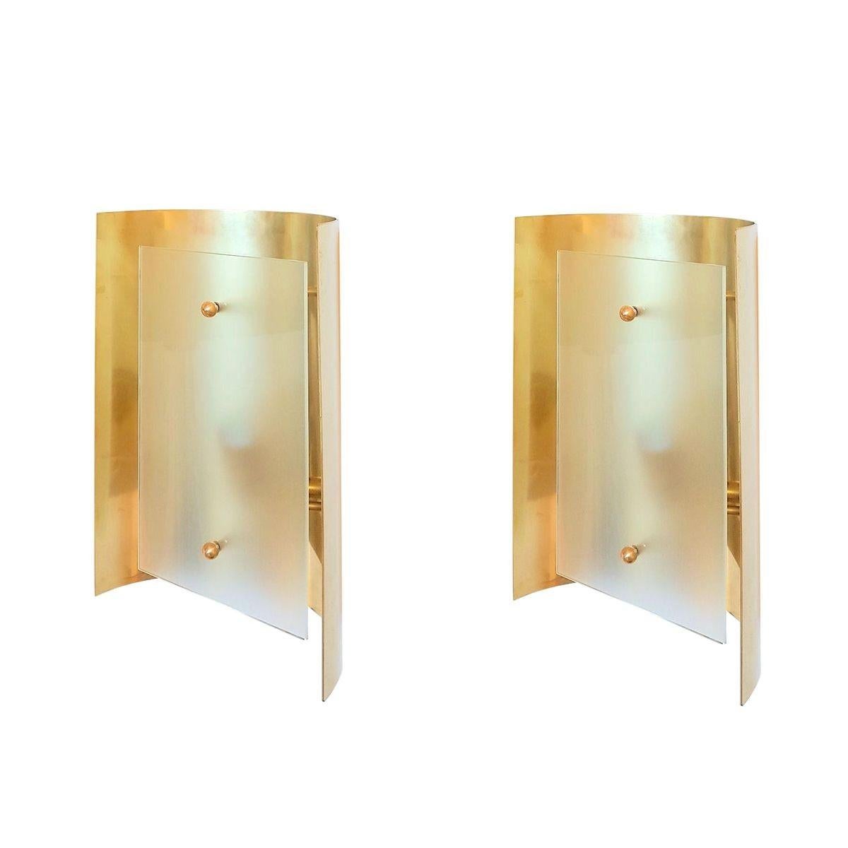 Pair of polished brass and frosted glass wall sconces or flush mounts, Italy 1970s.
Attributed to Sciolari.
1 light each. Professionally rewired for the US.
Mid century modern style pair of sconces.
Hand crafted by Italian artisans..
Matching
