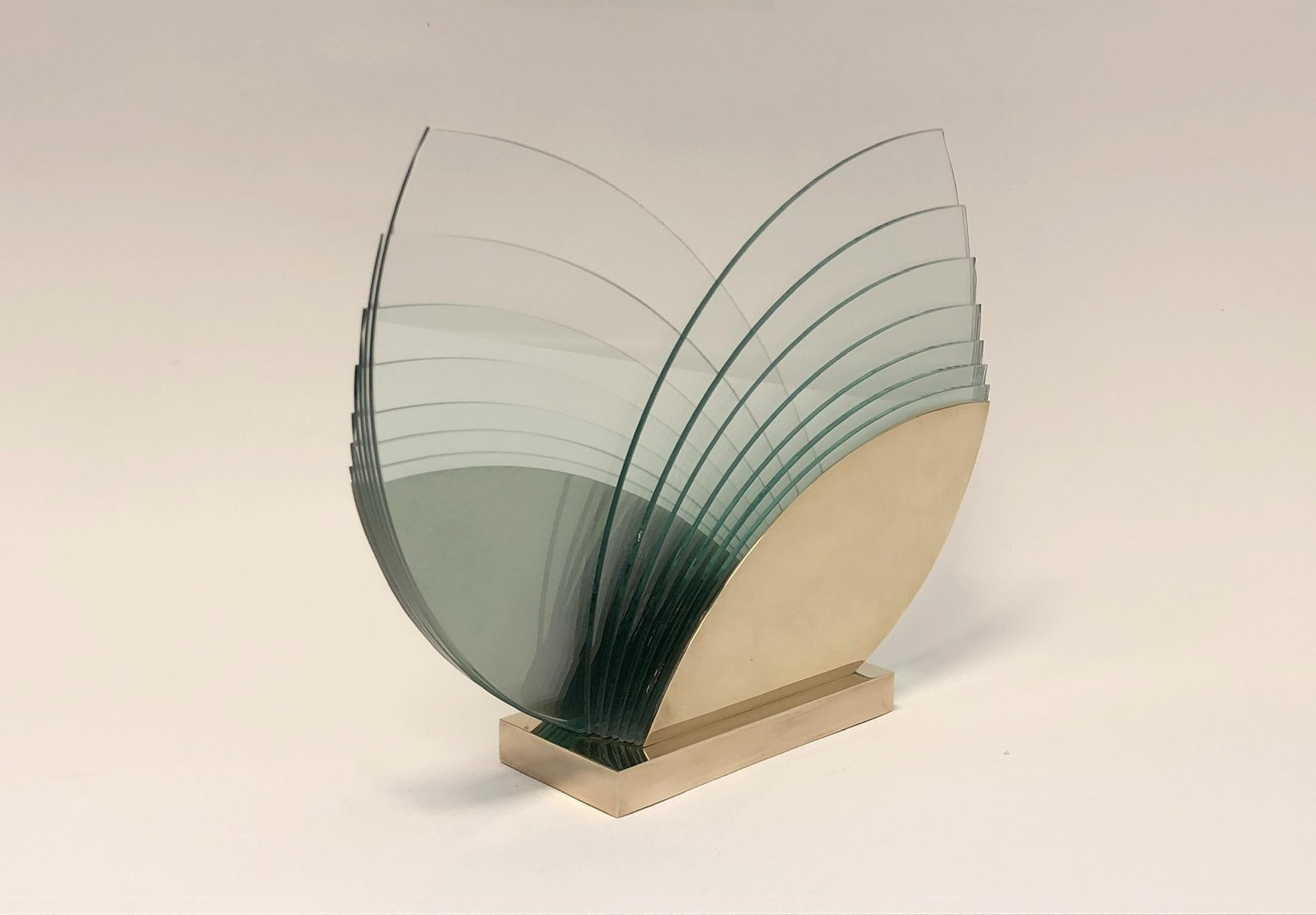 Spectacular polish brass and glass sculpture by California Artists Kurt & Marsha Runstadle. The sculpture is titled “Arpeggio” 15/15 signed and dated 1986. 

Dimension: 18” wide, 14” high, 4” deep.