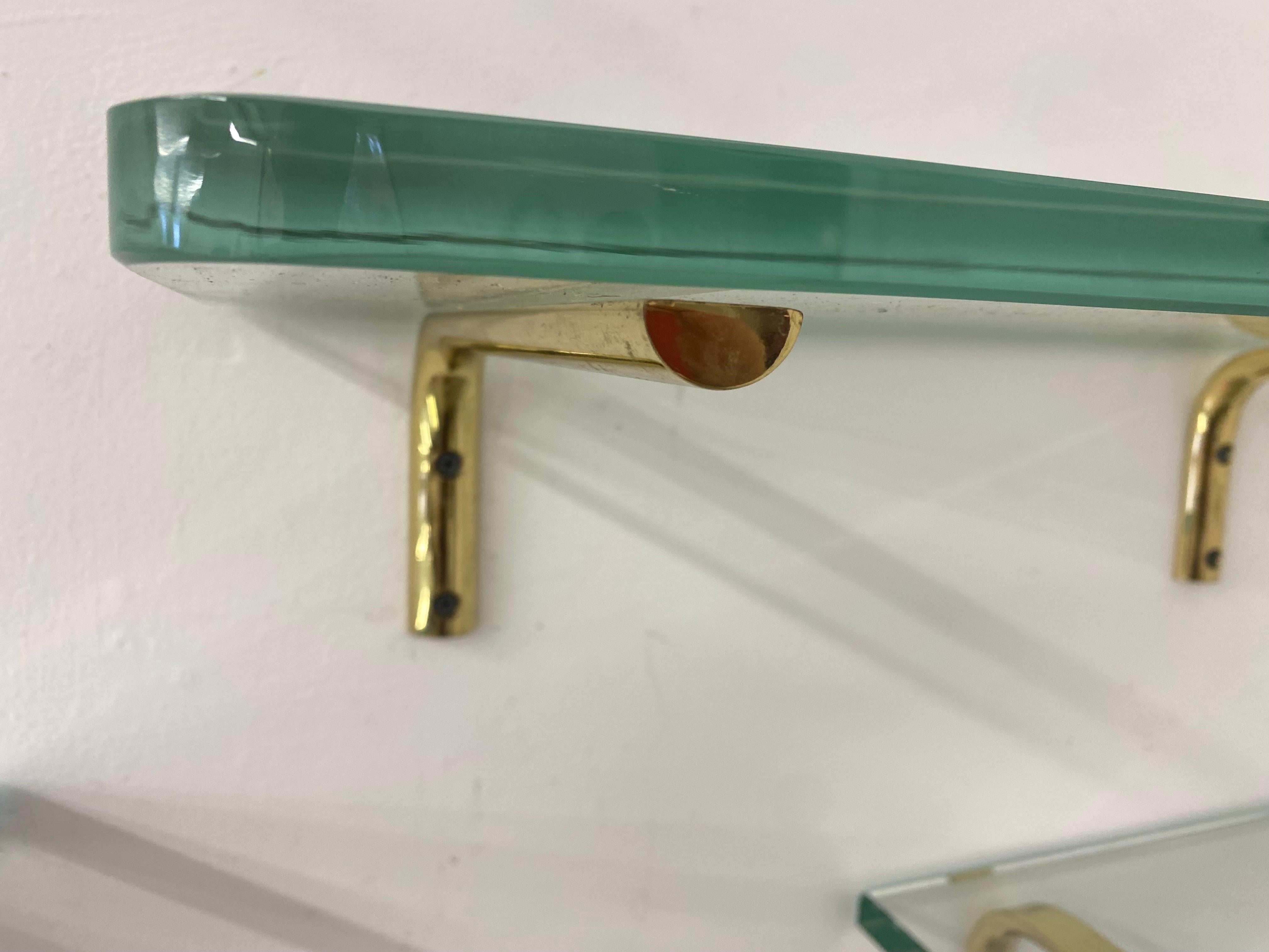 glass shelf with brass brackets