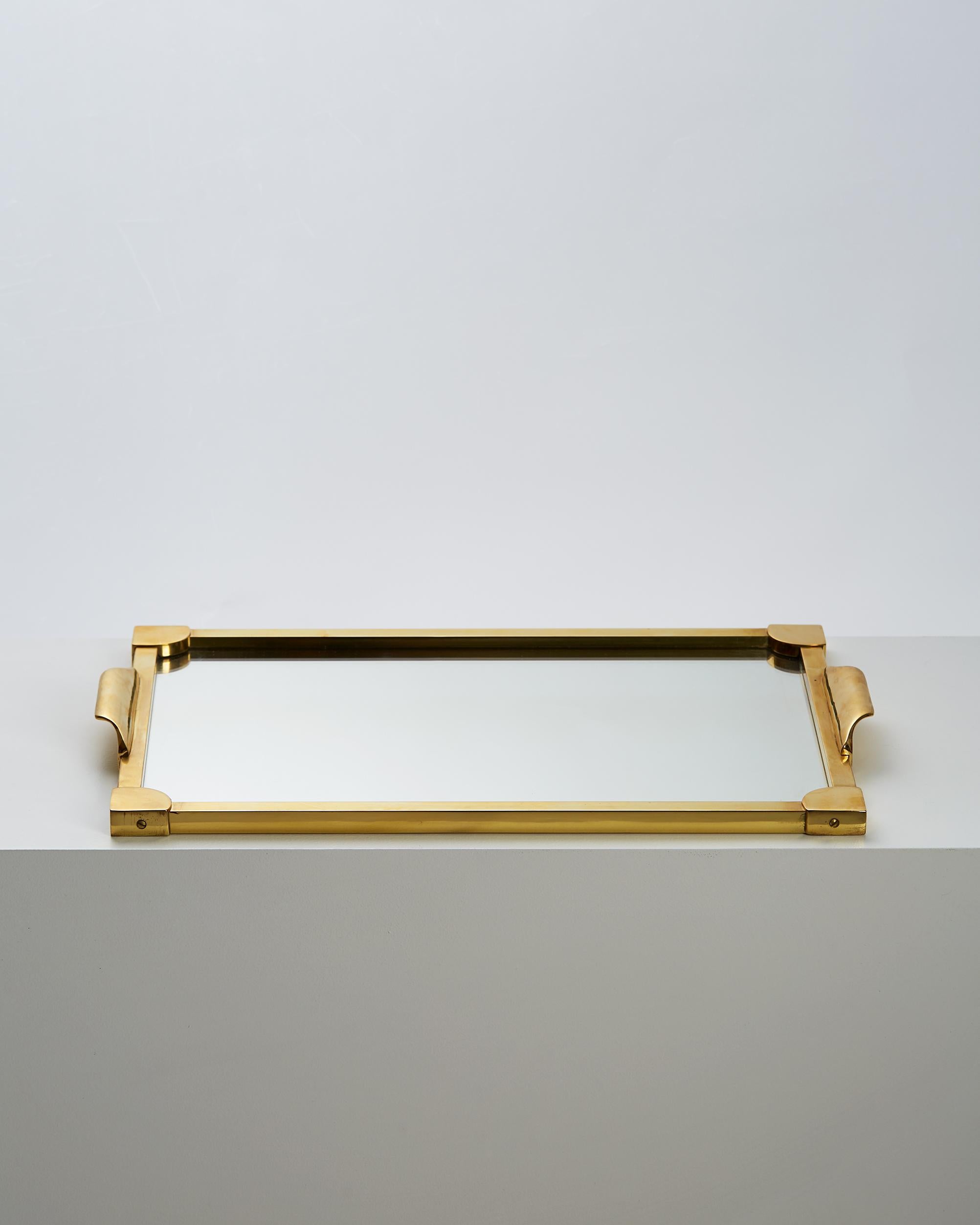 Tray, anonymous, 
Sweden, 1950s.

Brass and mirrored glass.

Measures: L 52 cm/ 1' 8 3/4''
W 33.2 cm/ 13 1/8''
H 1.5 cm/ 3/4''.
