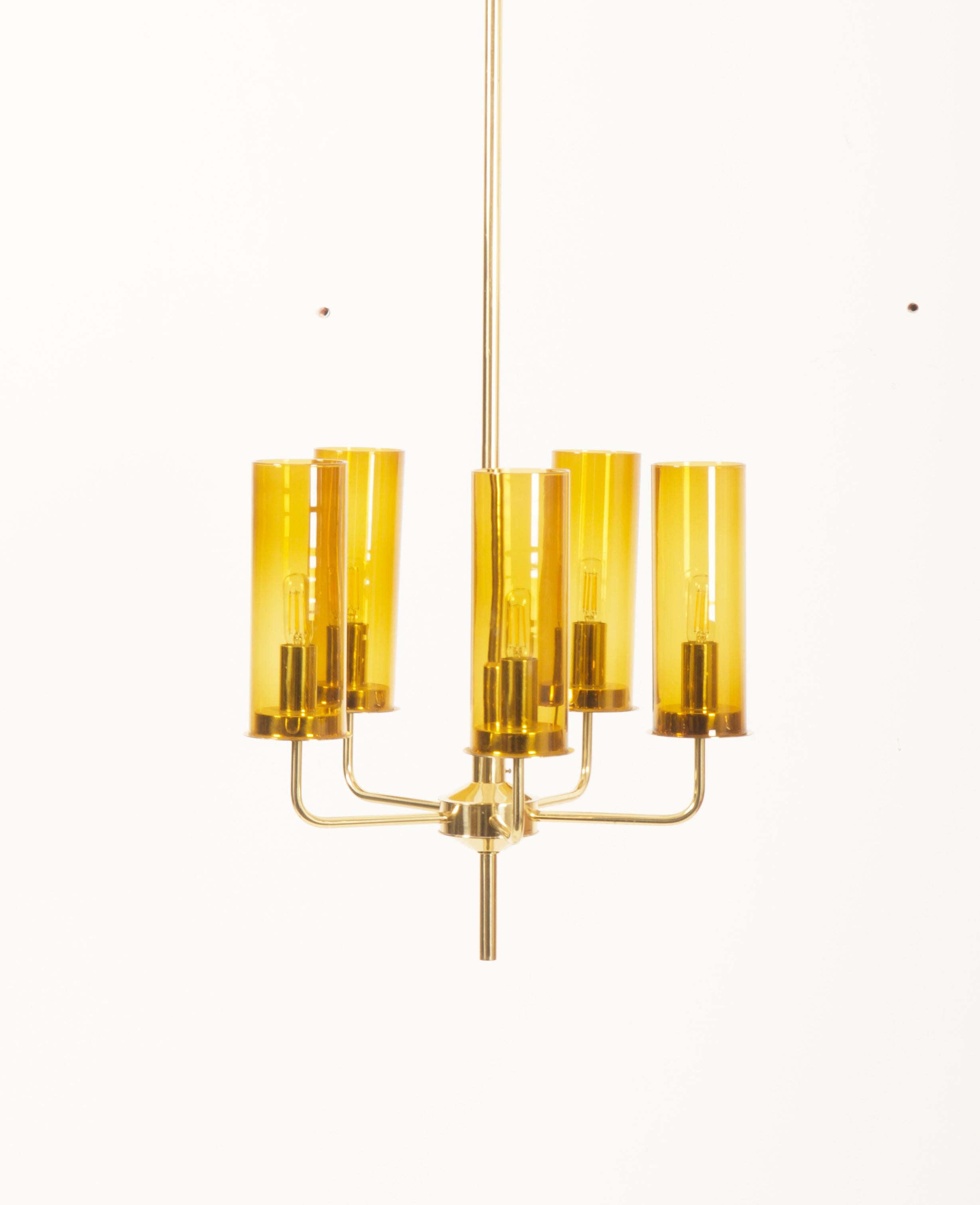 Brass frame with 5 anber glass tubes model T-434/5 ‘Sonata’ designed in the 1960s by Hans-Agne Jakobsson and produced by Hans-Agne Jakobsson AB in Markaryd, Sweden. Total height is now 175cm 68.90