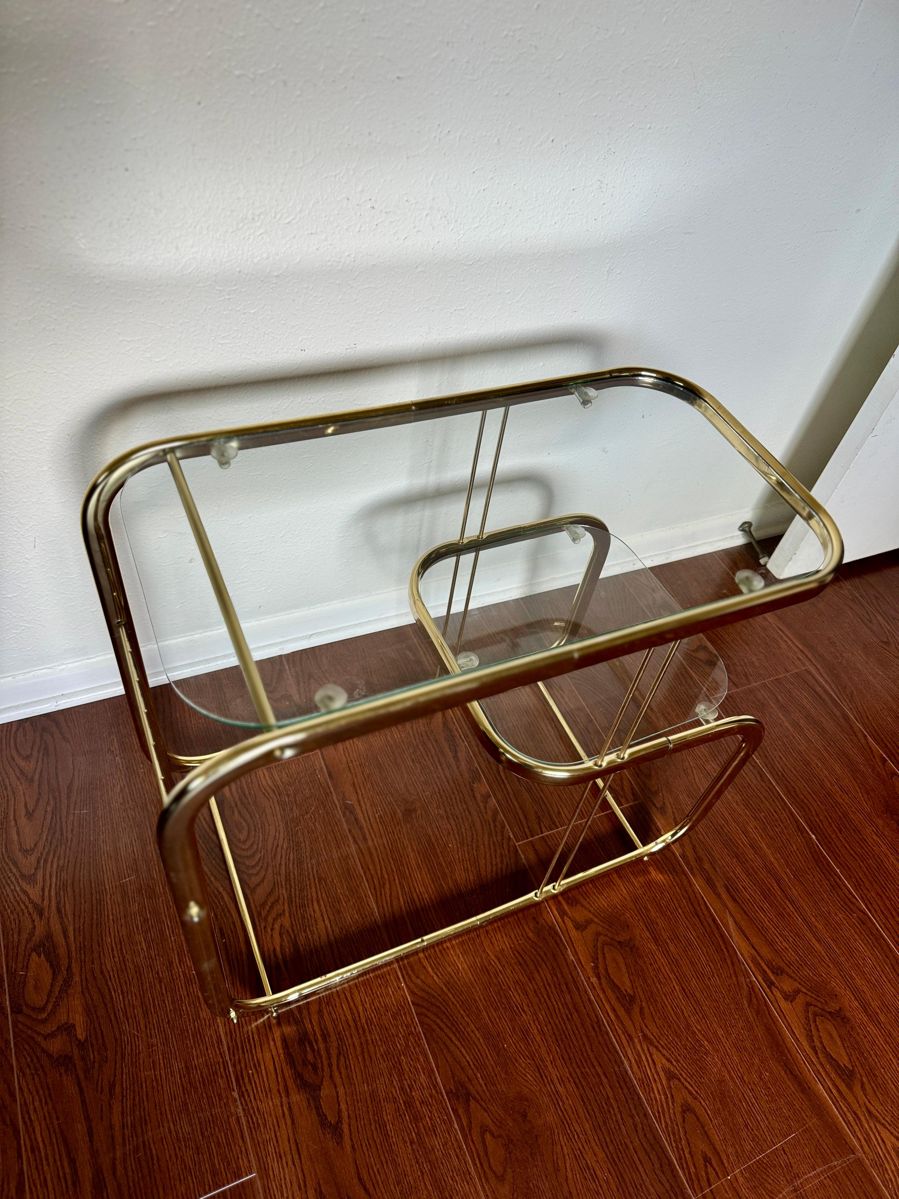 Brass and glass vintage bar cart in the style of Milo Baughman. 7