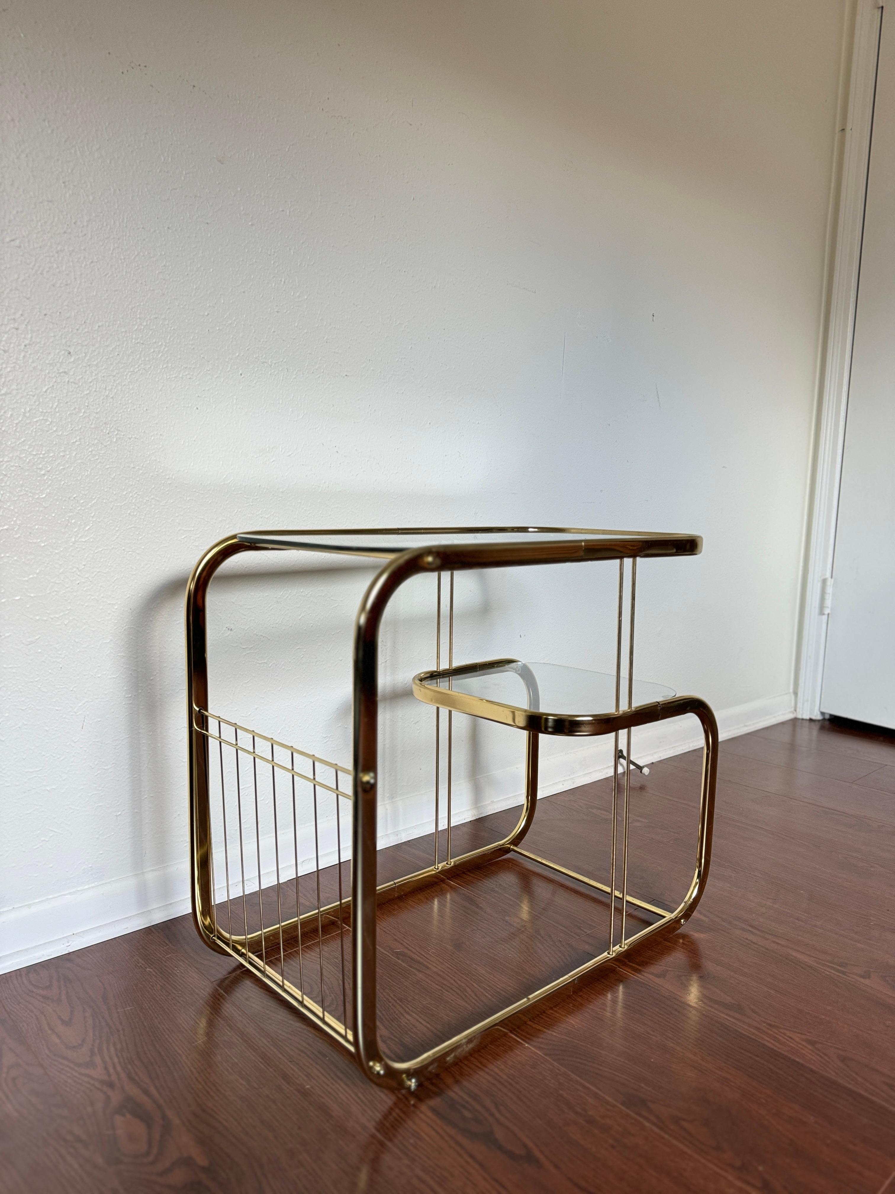 Mid-Century Modern Brass and glass vintage bar cart in the style of Milo Baughman.