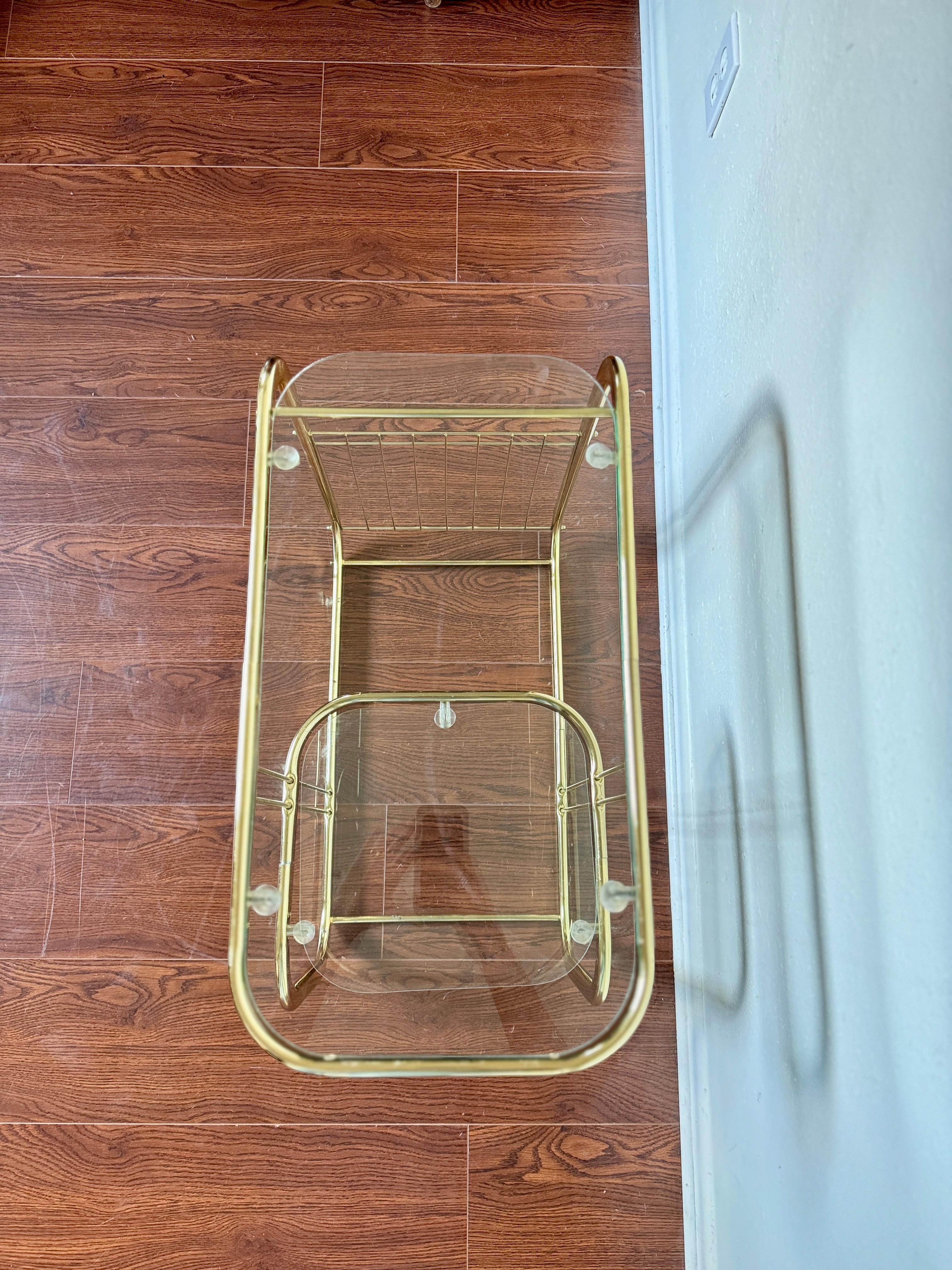 Unknown Brass and glass vintage bar cart in the style of Milo Baughman.