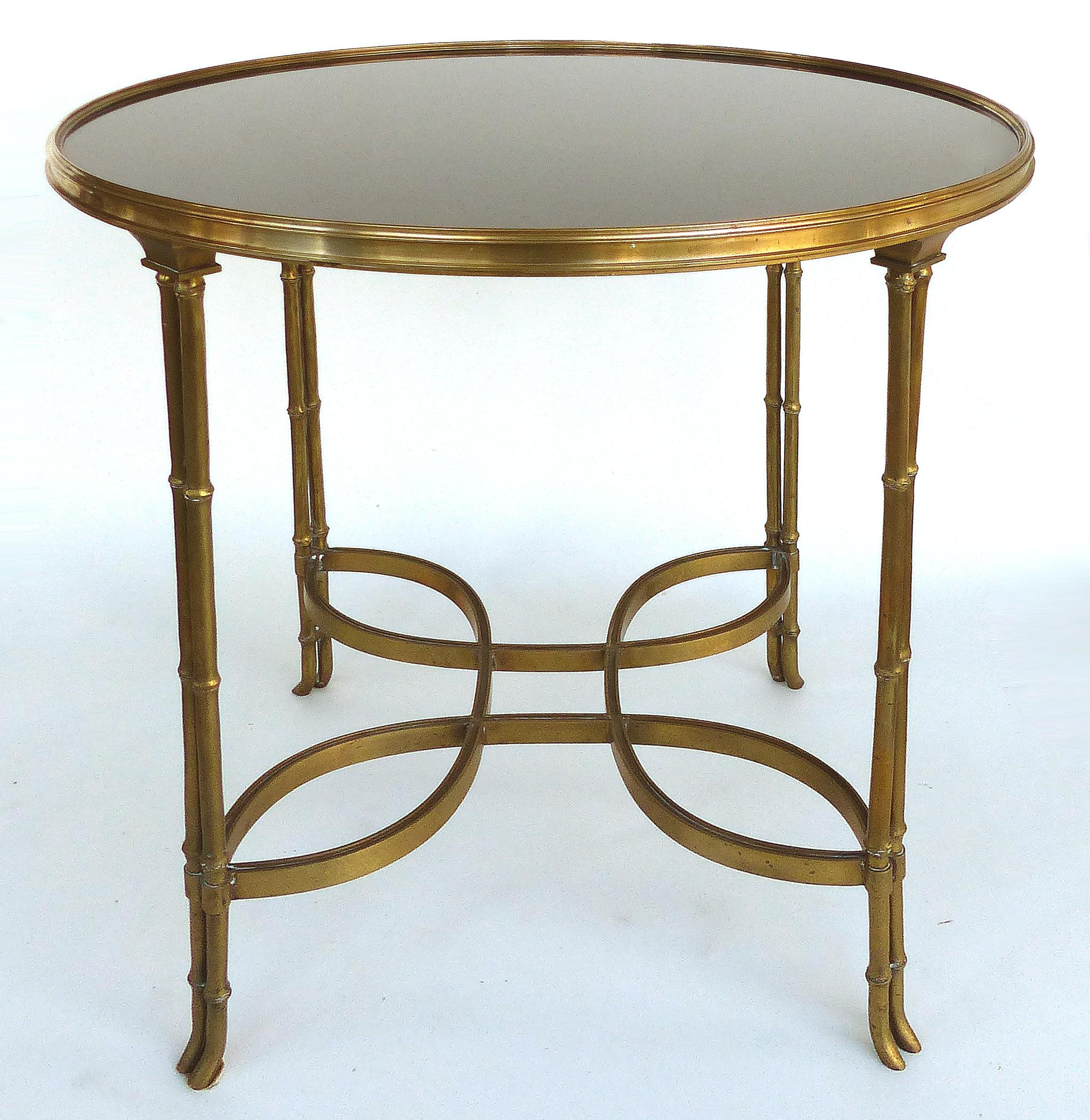 Brass and Granite Gueridon Table with Faux Bamboo Legs in Maison Jansen Style

Offered for sale is a brass gueridon side table with faux bamboo legs and an inset black granite top. The table is quite substantial in structure and is therefore very