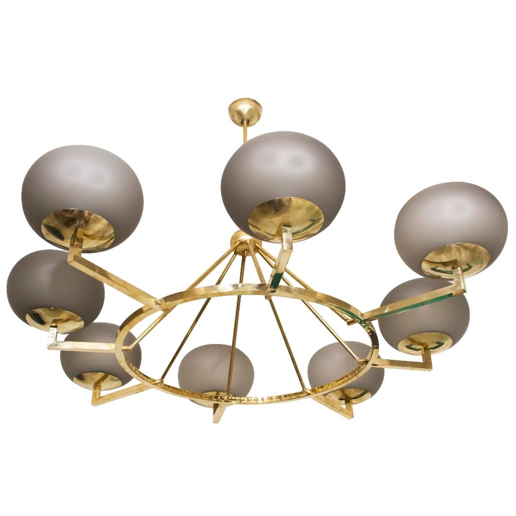 Extraordinary Italian brass and light grey opaline sphere Murano glass chandelier.
Inspired by Stilnovo, the iconic midcentury manufacturer.
Available also a pair. The brass height is customizable.
8 E27 light bulbs.
 