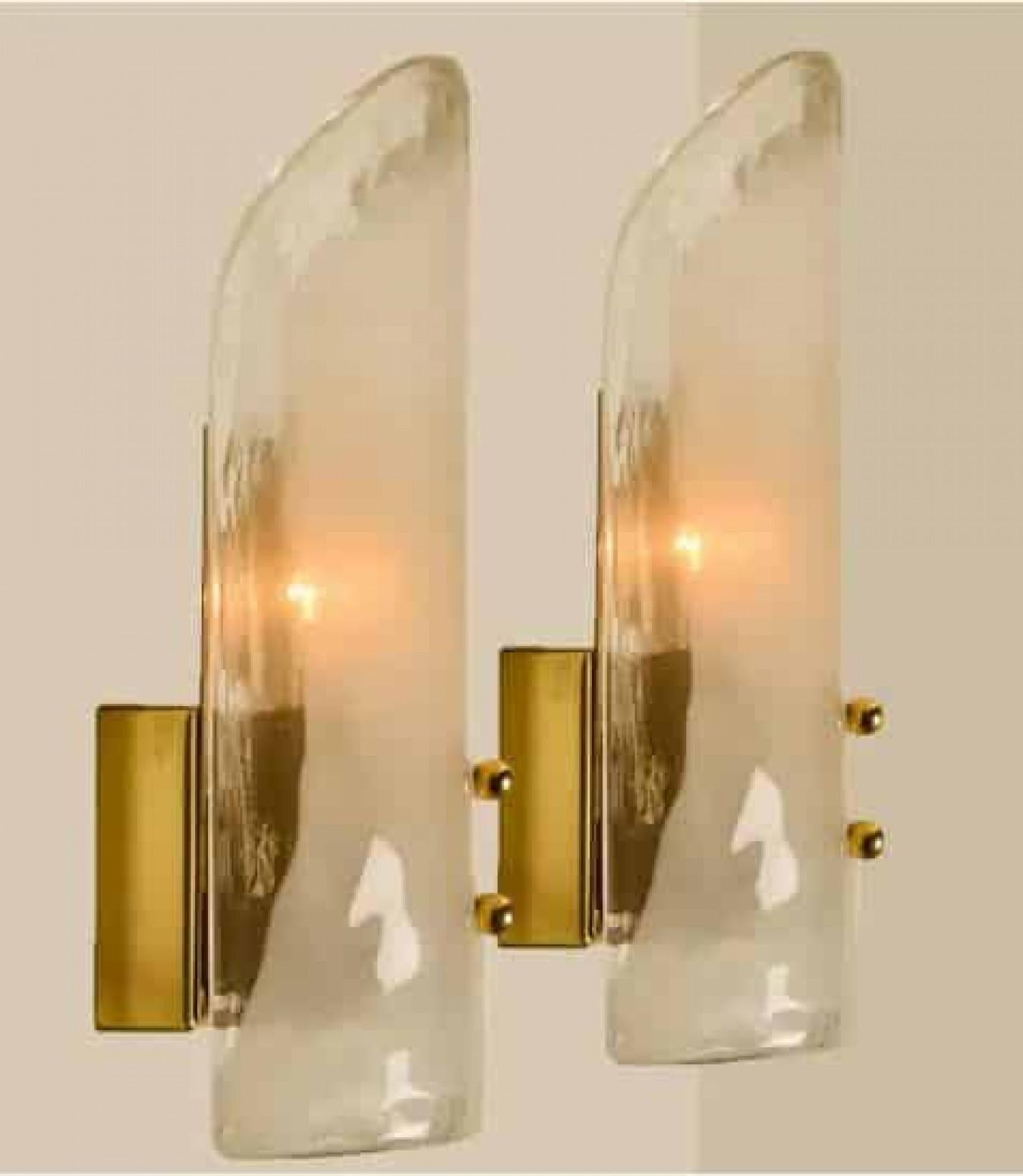 High-end wall sconces made of blown clear and opal Murano glass on a messing hardware. Designed and produced by J.T. Kalmar, Austria in the 1960s. Minimalistic design executed with a taste for excellence in craftsmanship. These are real statement