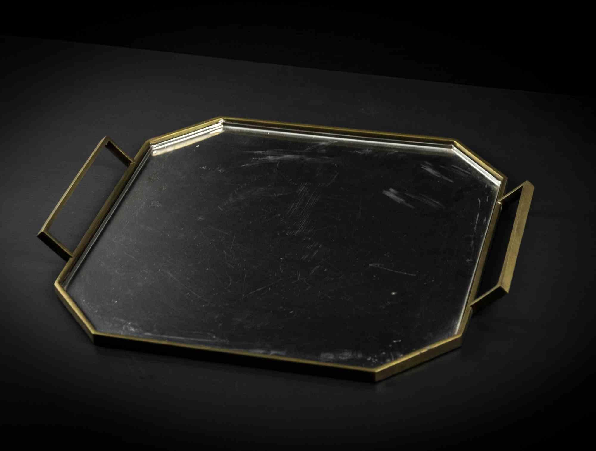 Brass and Inox argent geometrical serving tray is an original object realized in the 1970s.

Made by Gottinghen in inox argent 18/10. 

Silverplated.

Mint conditions.