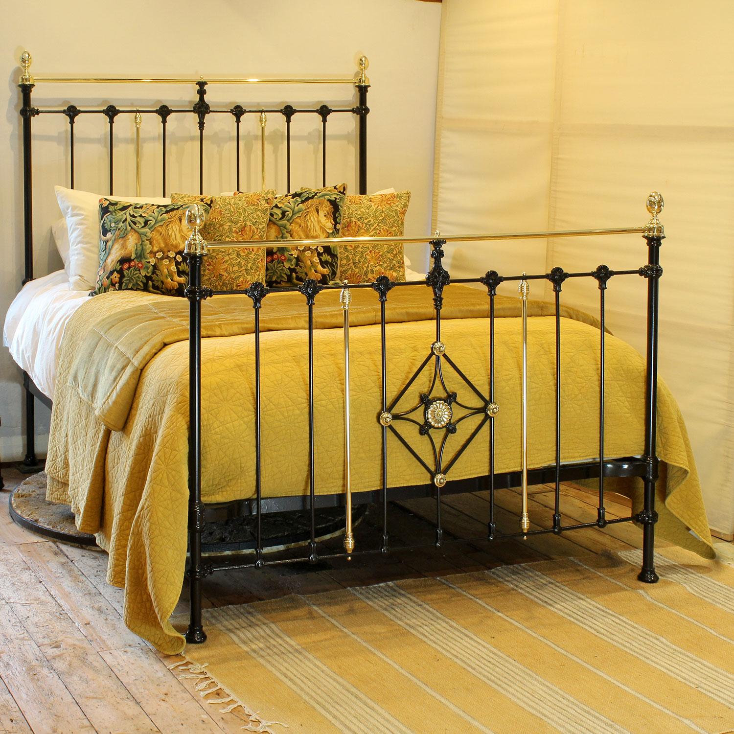 A handome Victorian brass and iron bed finished in black with decorative feature in the foot panel, cap collar,s oval brass knobs and decorative castings.

This bed accepts a UK King or US Queen, 5ft or 60in wide, mattress and base.

The price
