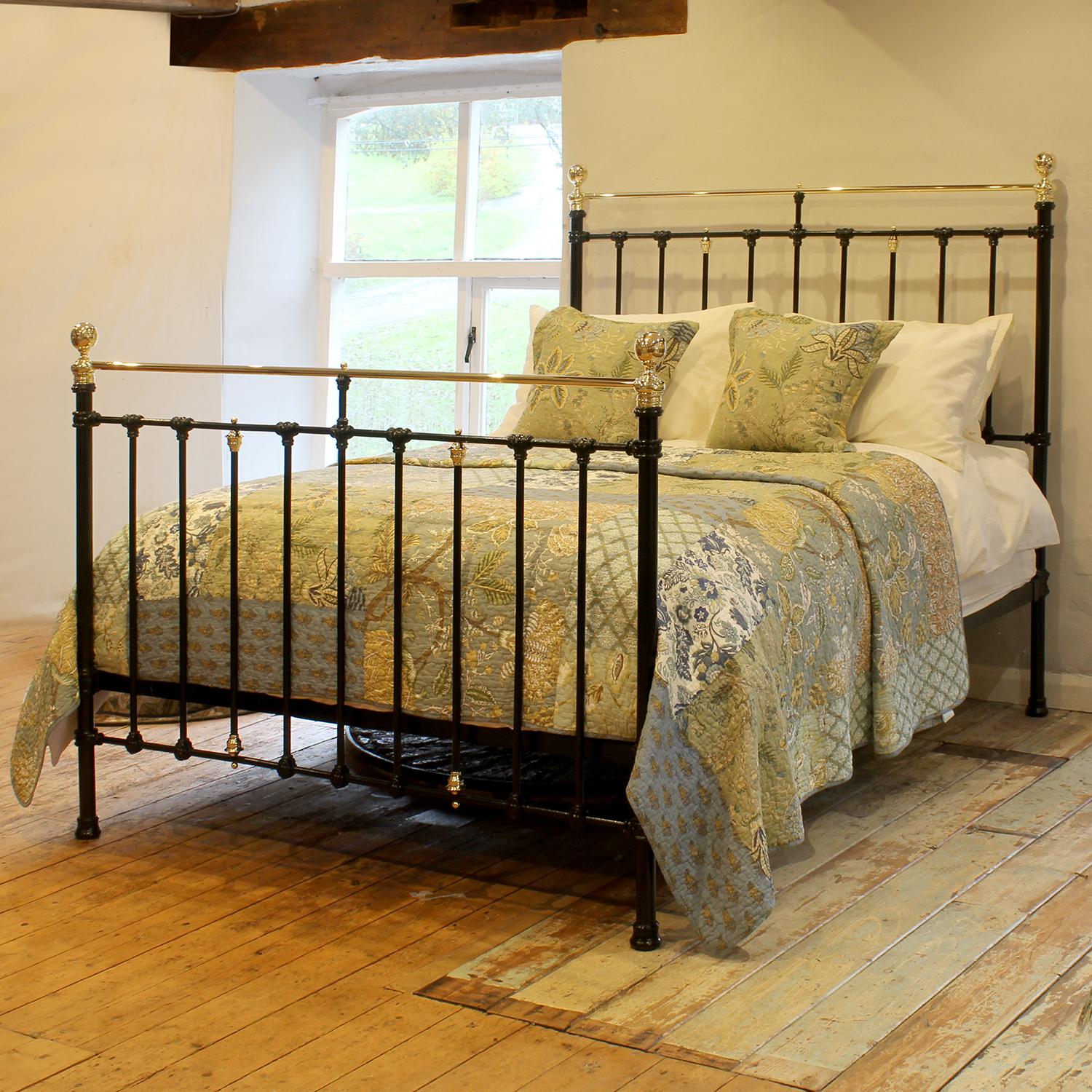 An attractive cast iron Victorian antique brass and iron bed finished in black with brass decoration.

This bed accepts a UK king size or US queen size (5ft, 60in or 150cm wide) base and mattress set.

The price includes a standard firm bed base to