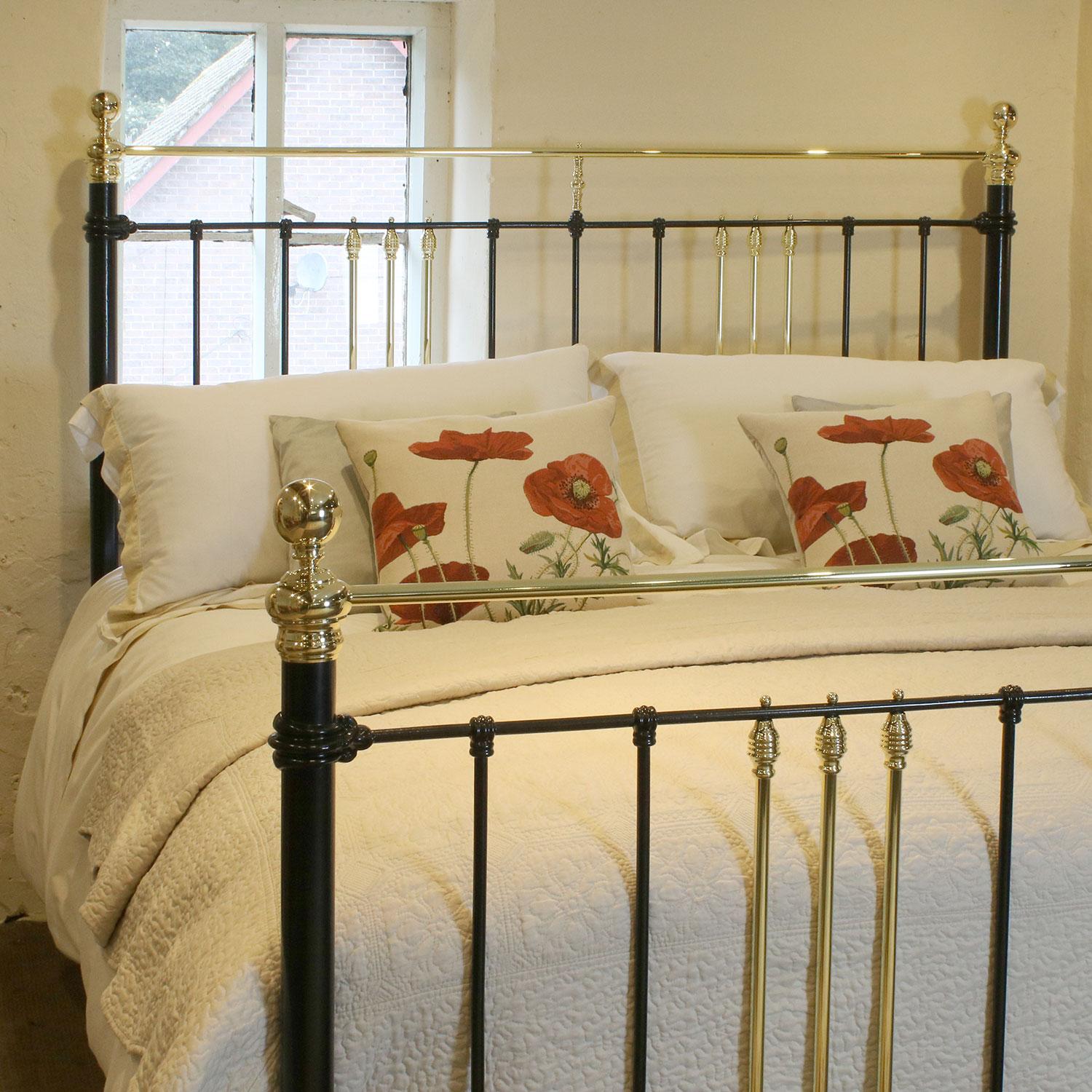 6ft antique bedstead in black with a straight brass top-rail and simple castings. 

This bed accepts a British super king size or Californian king-size. (72 inches, 6ft or 180cm wide)

The price includes a standard firm bed base to support the