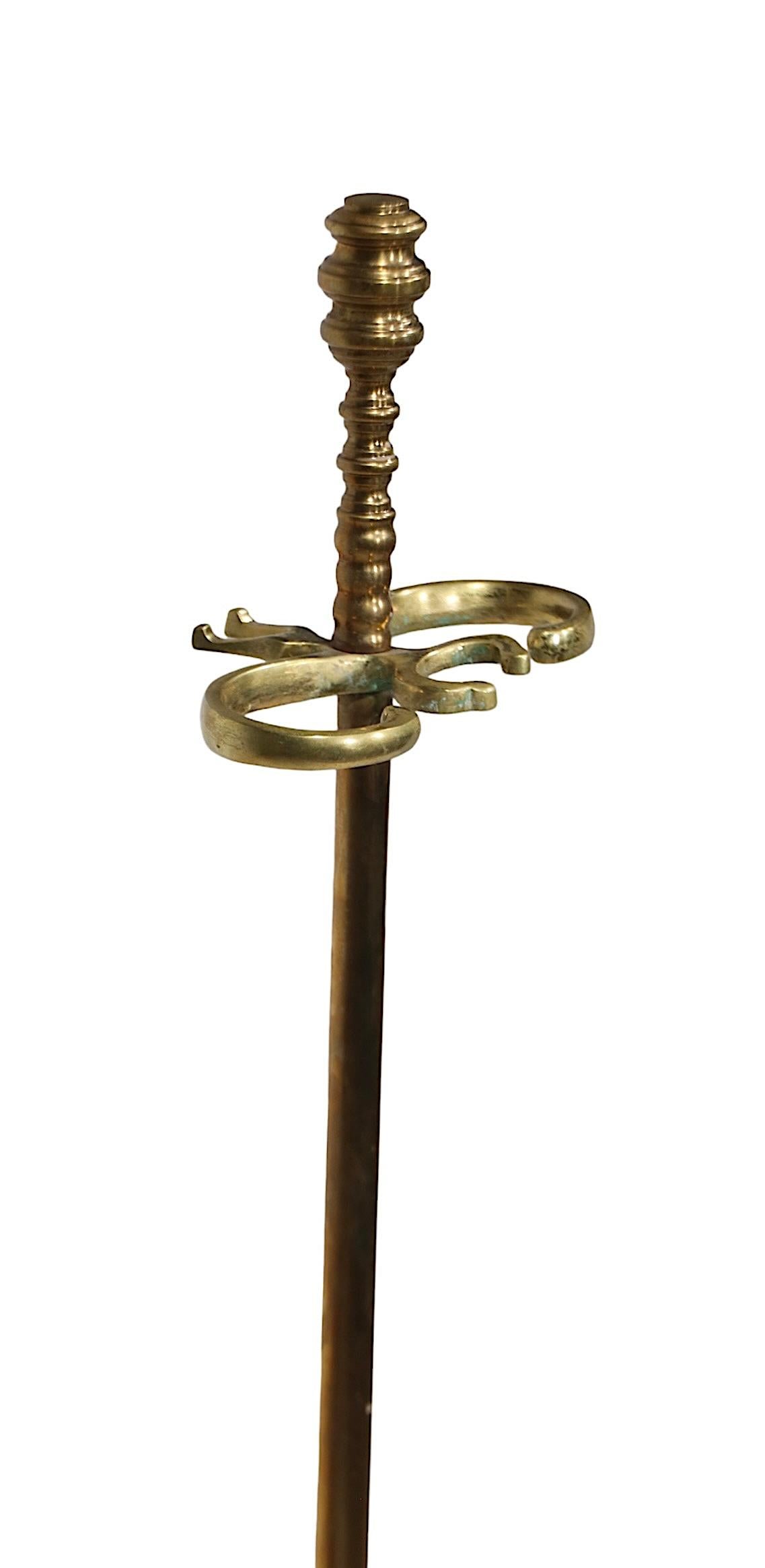 Exceptional fireplace tool set by highly regarded maker, Virginia Metalcrafters, made in the USA circa 1960/70's. The set includes the brass stand, and a  mixed metal ( brass and iron )  shovel, poker, and tongs. All pieces are in very fine, clean,