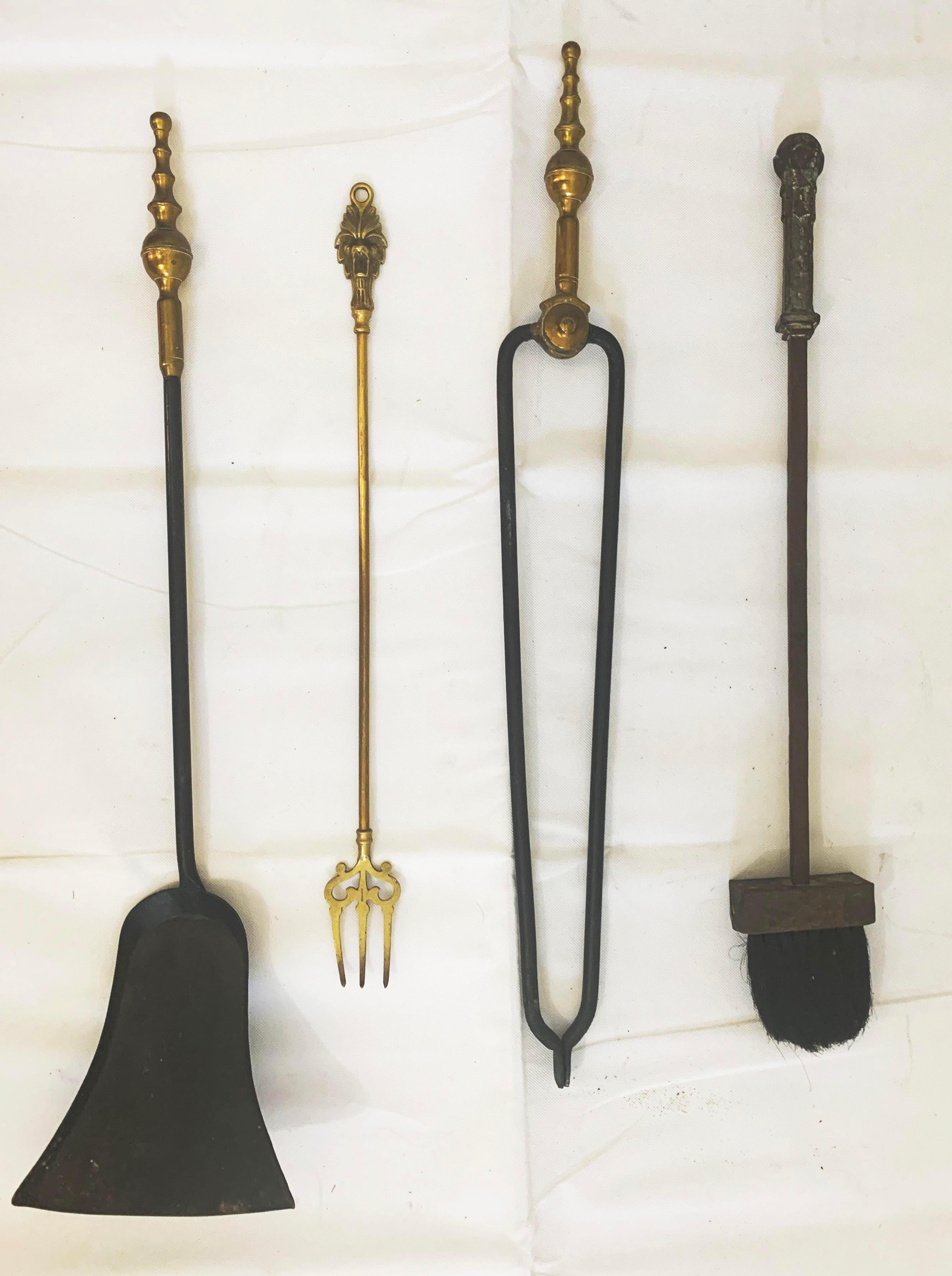Exquisite set of hand made brass fireplace tools from England (late 1800s) along with hand forged iron brush from France (mid 1800s). Set includes shovel, fork, tongs, brush and stand.

Dimensions:
Shovel 
28