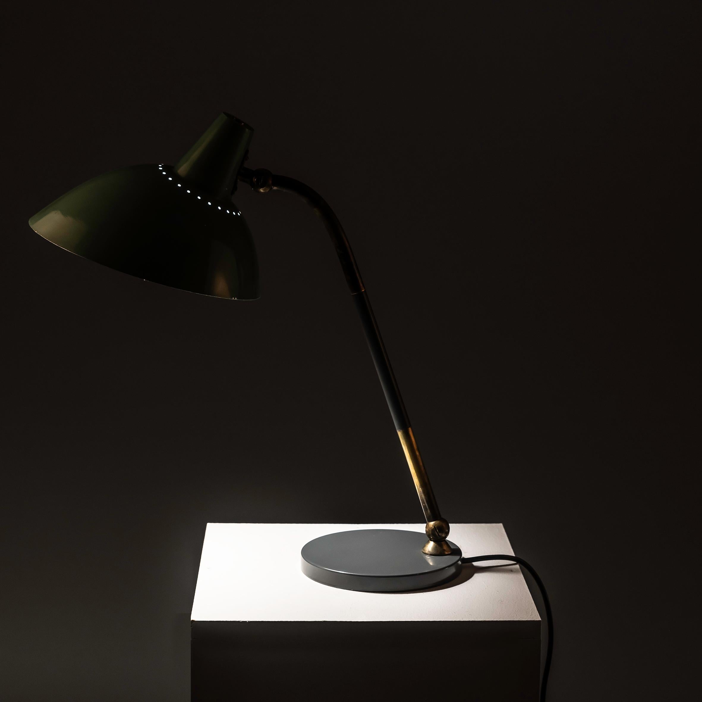 Investing in this Brass and Lacquered Aluminum Table Lamp by Metalarte, designed in the style of Stilnovo, offers a captivating blend of mid-century modern elegance and functionality. Crafted with meticulous attention to detail, this lamp showcases