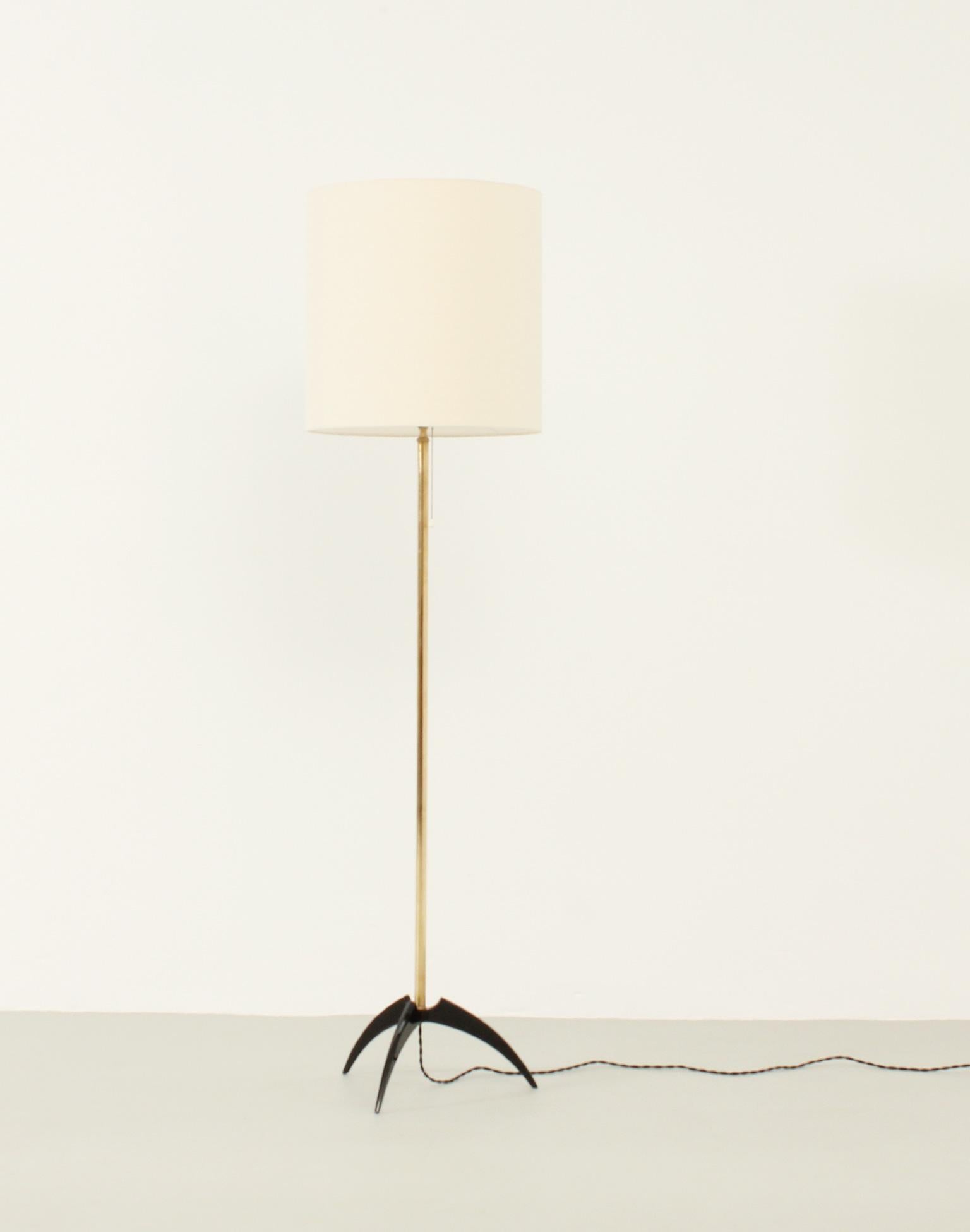 Elegant floor lamp in brass and black lacquered metal base, Spain, 1950's. Shade with new fabric.