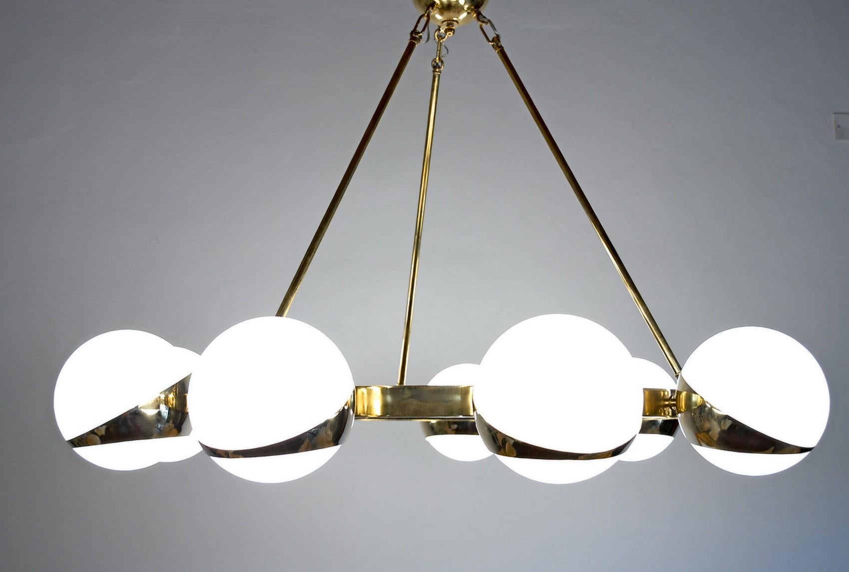 Mid-Century Modern Brass and lattimo glass chandelier, 9 spheres Stilnovo Designed for light output