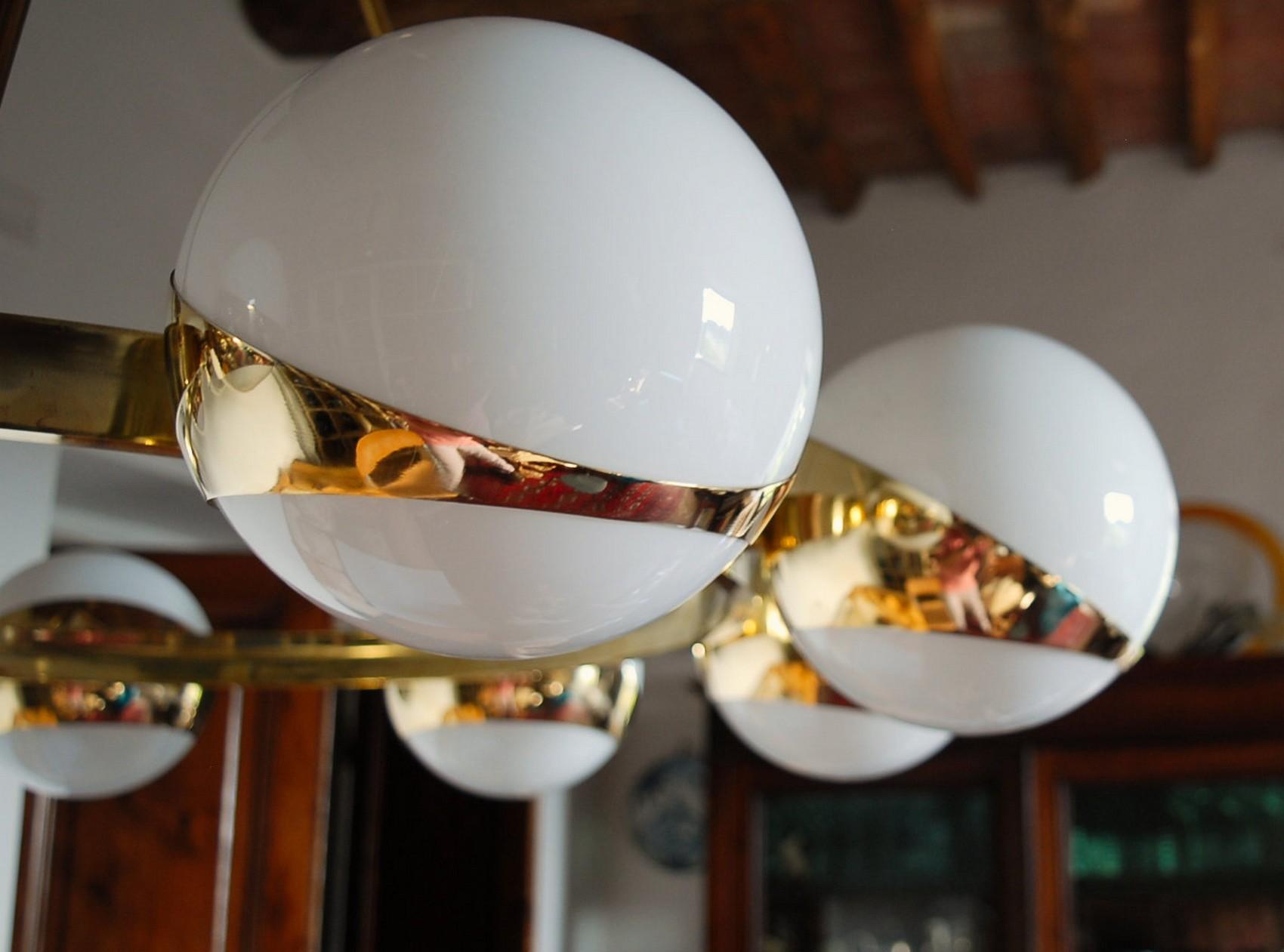 Brass and lattimo glass chandelier, 9 spheres Stilnovo Designed for light output 1