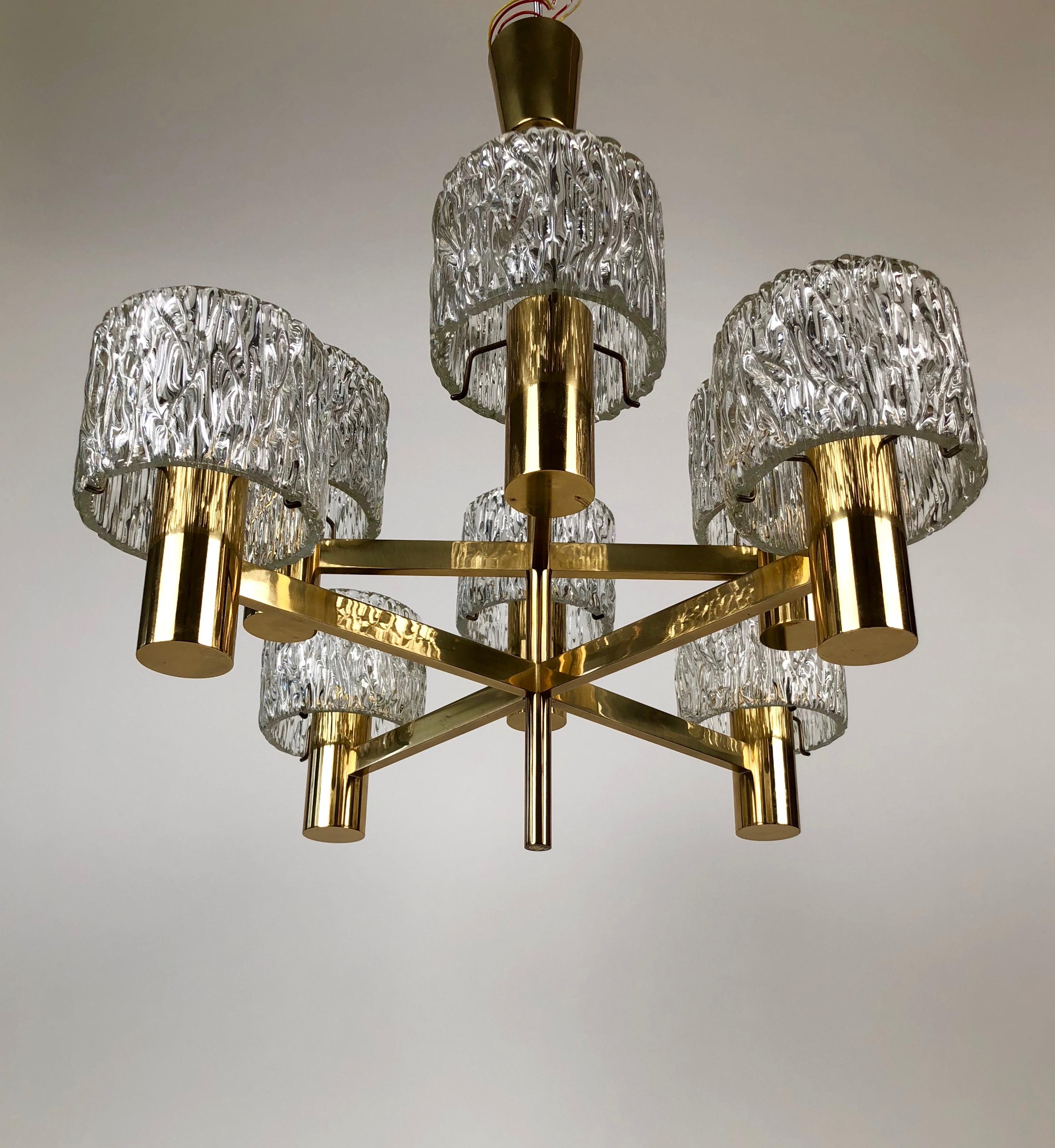 Chandelier made from the Austrian company J. T. Kalmar in the 60´s.
Solid brass construction with 8 arms and shades in massive lead glass.
The lamp is in a very fine condition.