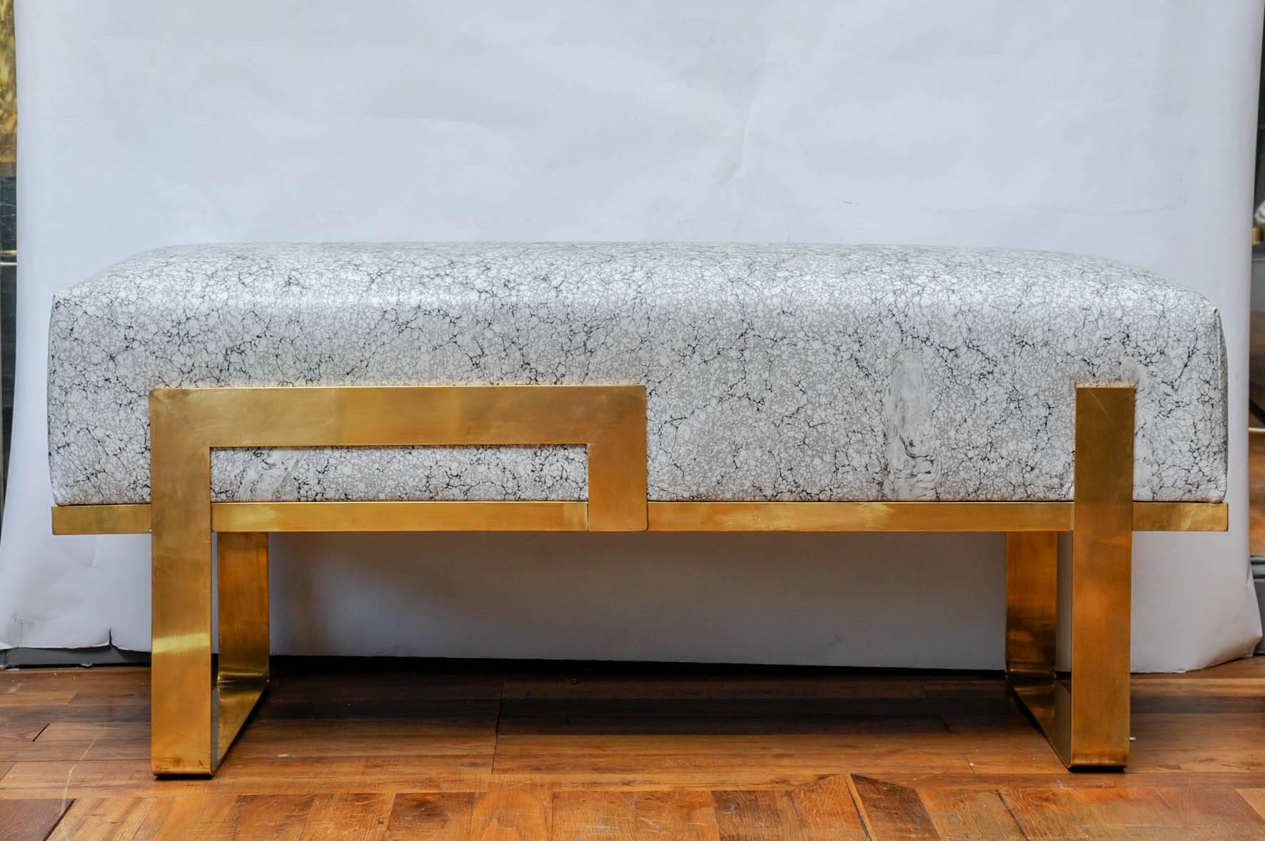 Beautiful bench with a brass structure, upholstered with Japanese hand-printed leather. This unique piece is designed by the Studio Glustin.