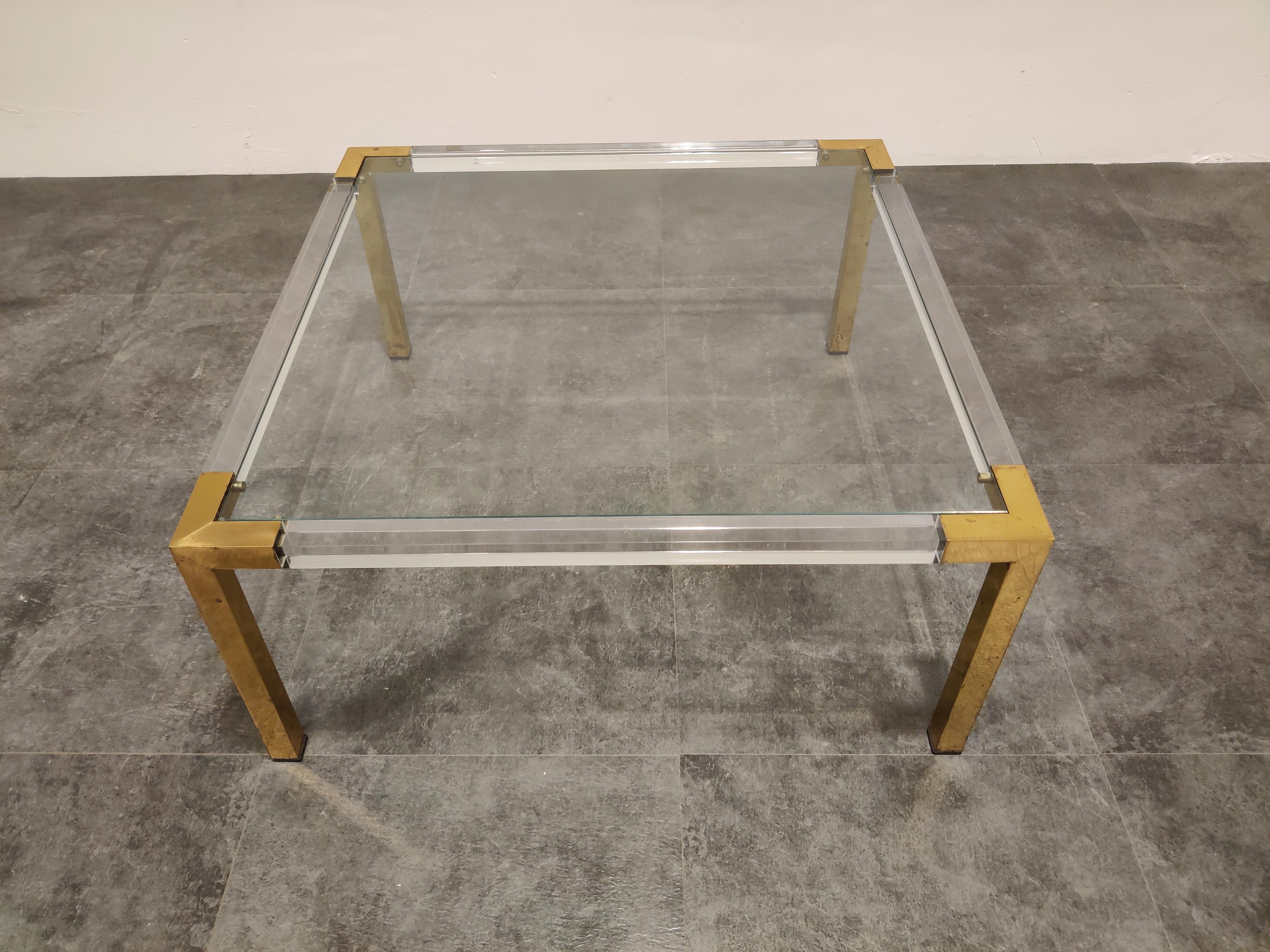 Vintage brass legged and Lucite coffee table with a glass top.

In the manner of Charles Hollis Jones.

Very good condition,

1970s, Belgium

Measures: Height 36cm/14.17