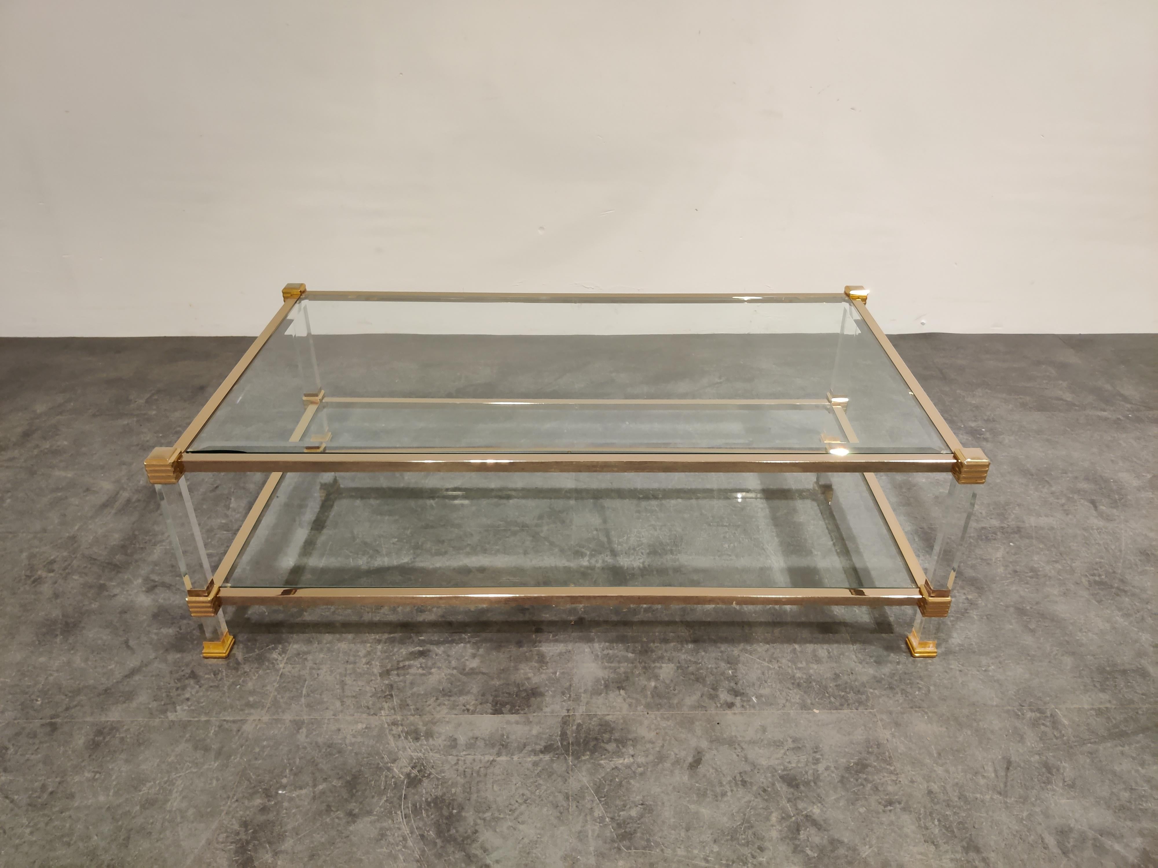 Vintage rectangular two tier coffee table made from Lucite and brass with clear glass,

1970s, France

Good condition, clear glass tops

Measures: Height 35cm/15.74