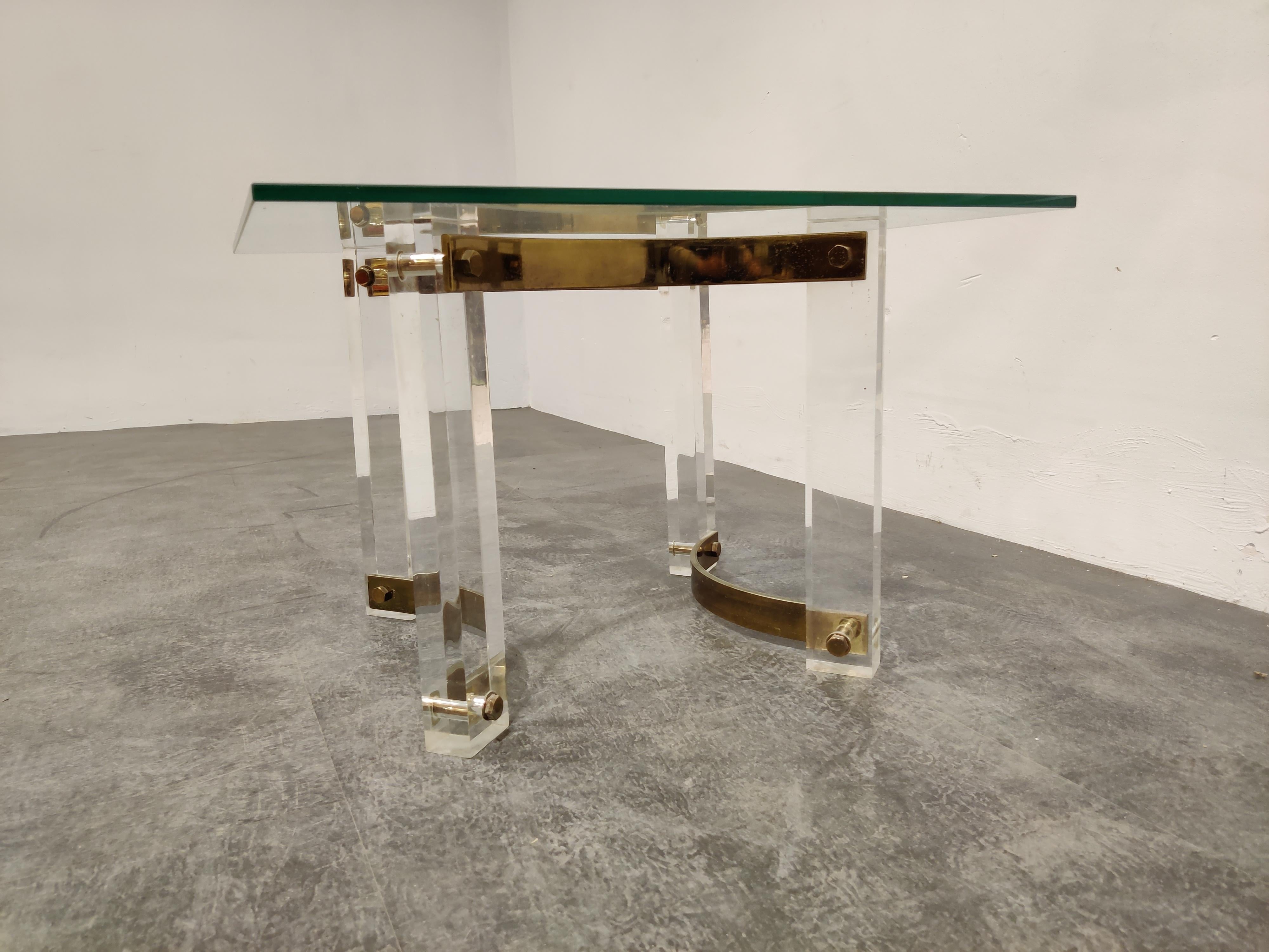 We can also ship the base only to save shipping costs and you can order a glass locally.

Vintage Lucite and brass coffee table consisting of a nicely designed brass and Lucite base and a clear glass top,

1970s, France

Frame is in good