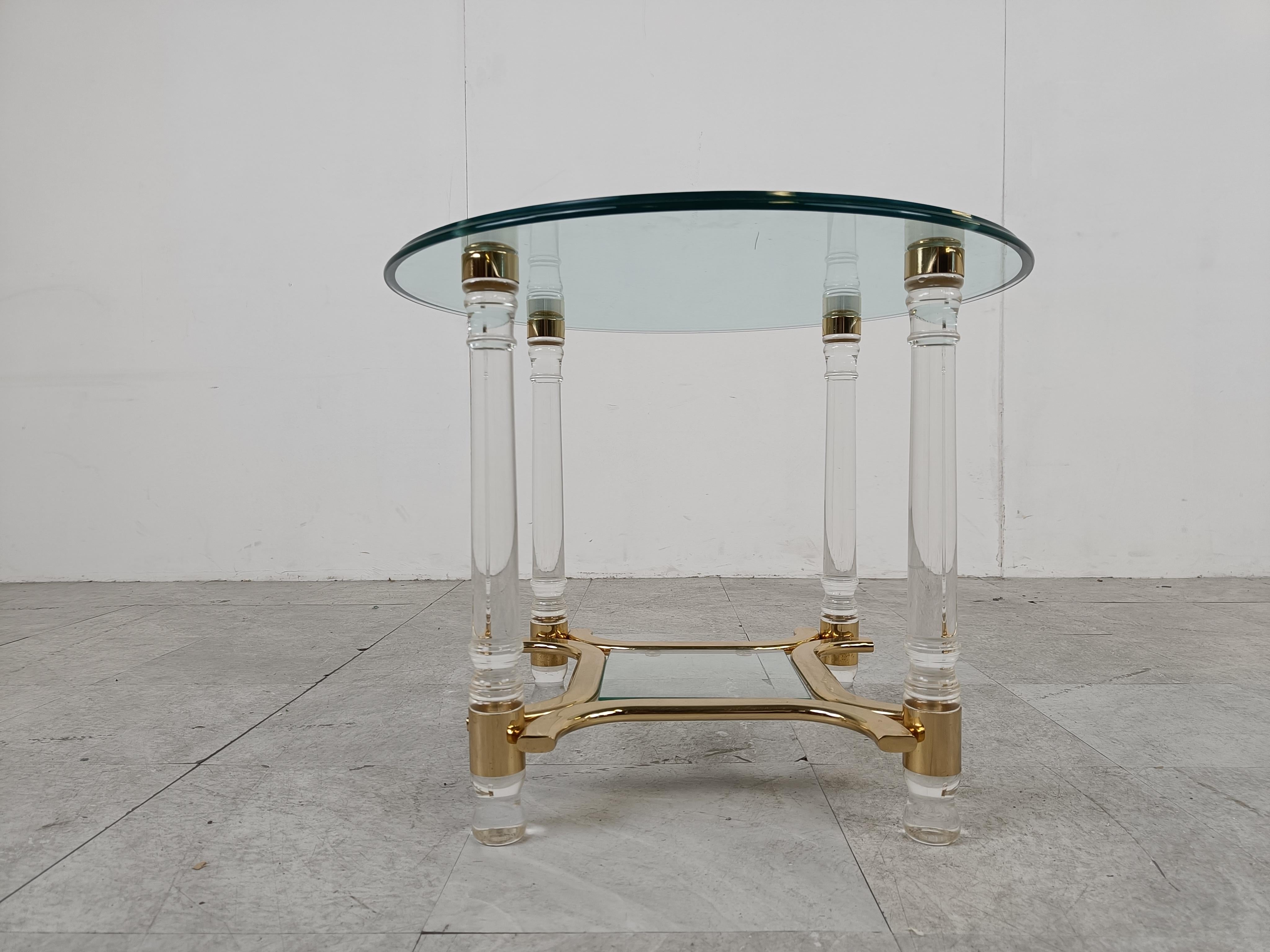Vintage lucite, glass and brass two tier round side table.

Timeless piece which works with modern day interiors or great to combine with other seventies/eighties glam pieces.

1970s - Belgium

Good overall condition with normal wear and tear.