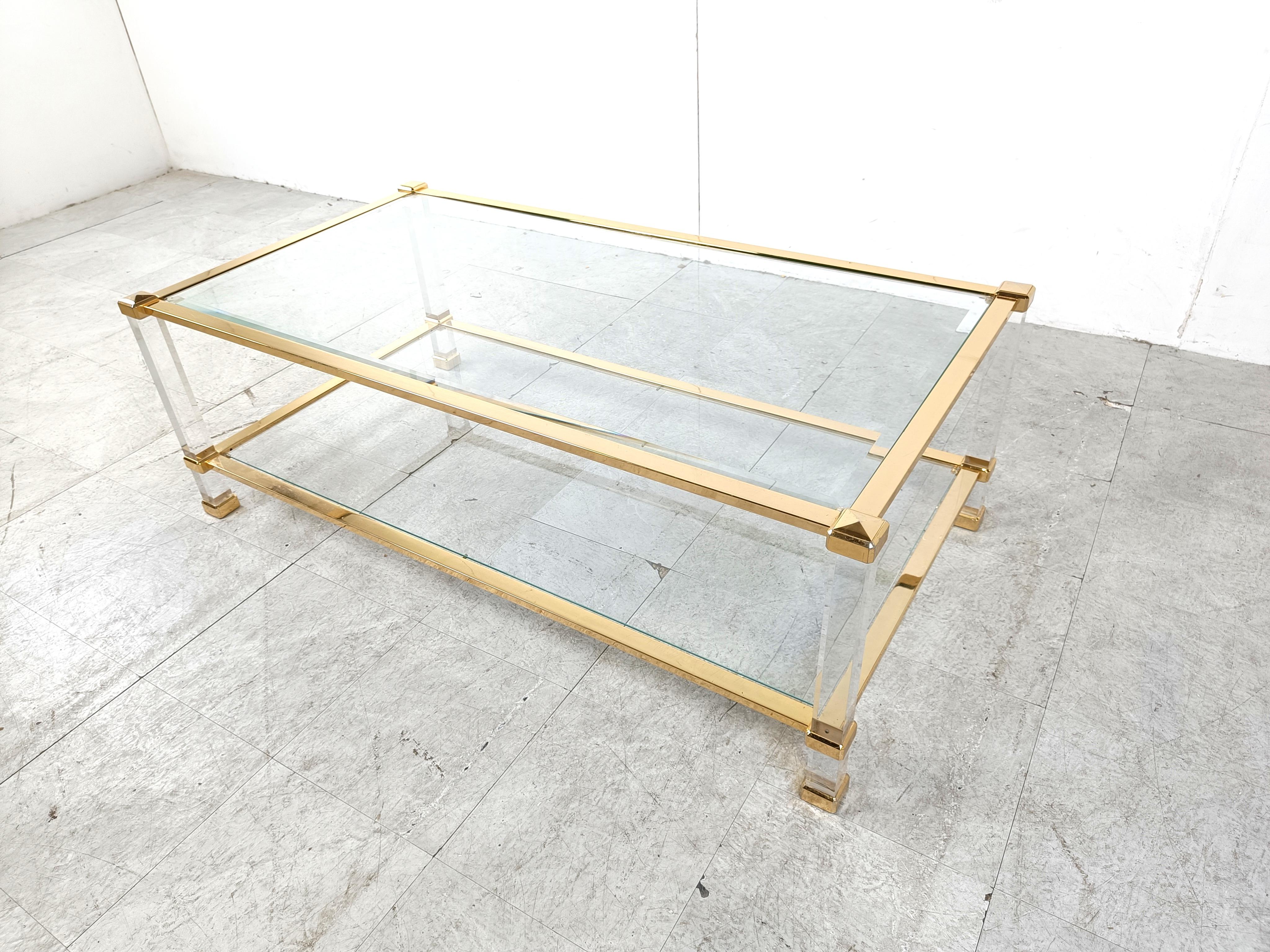 Vintage rectangular two tier coffee table made from lucite and brass with clear glass.

1970s - France

Good condition, clear glass tops

Height: 45cm
Width: 130cm
Depth: 70cm

Ref.: 546664
