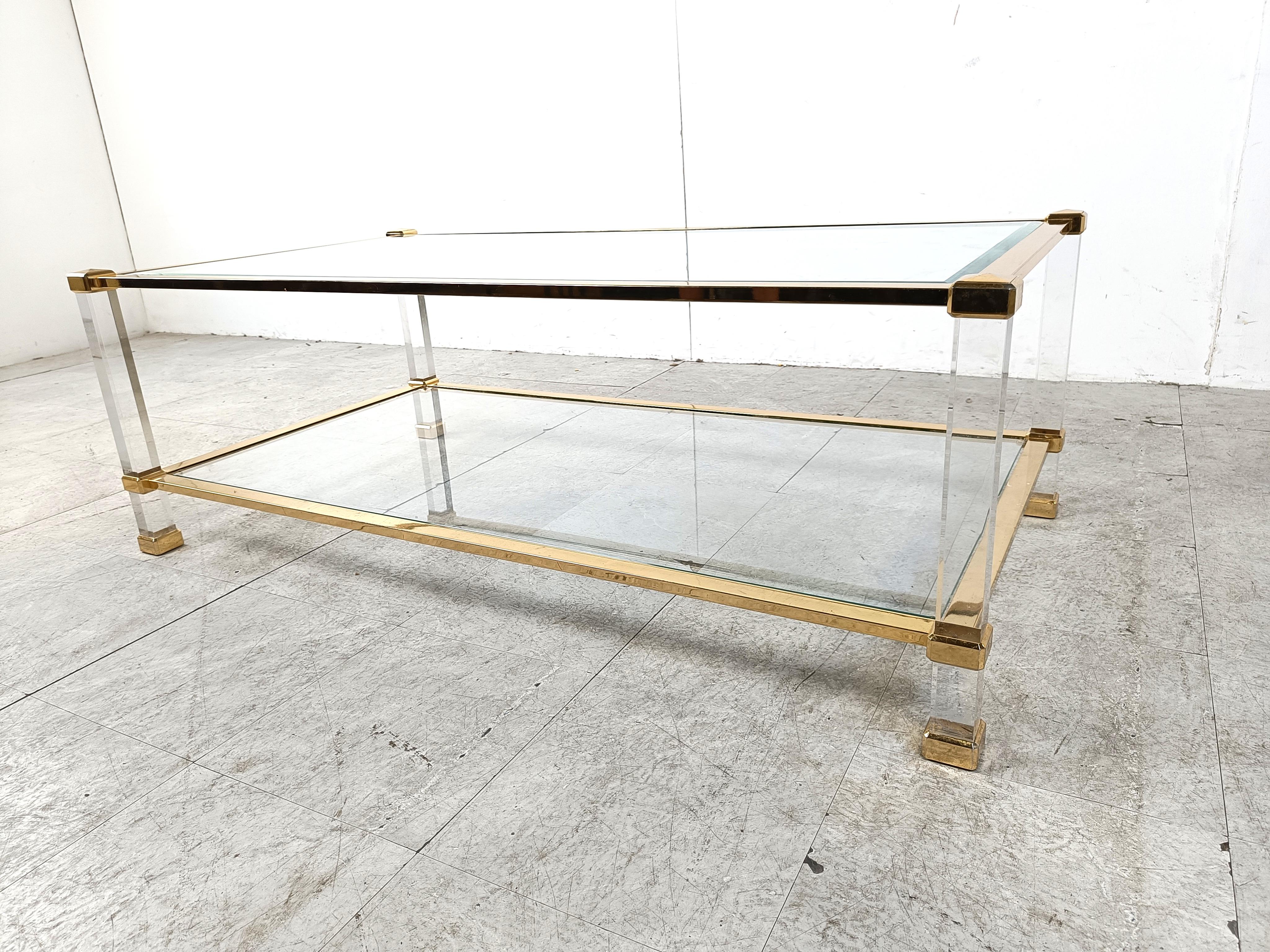 Hollywood Regency Brass and lucite coffee table, 1970s For Sale