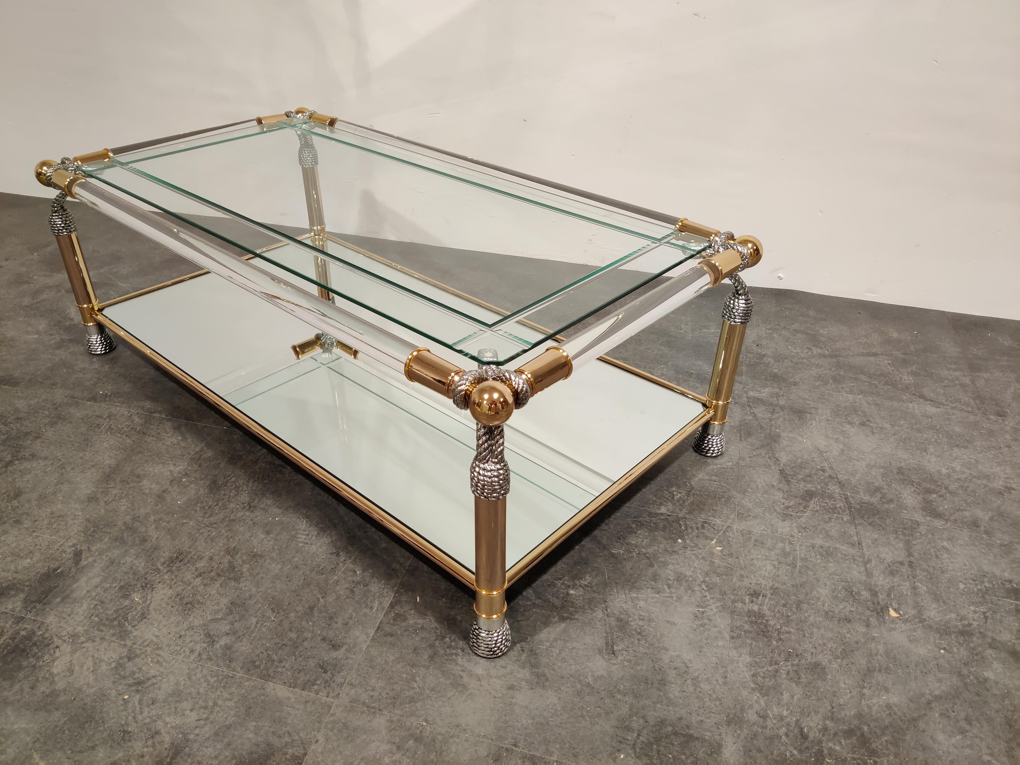 Unique coffee table with brass and Lucite frame and faux rope finish. Clear reeded and mirrored glass.

Beautiful Hollywood Regency style. 

Very good condition.

1980s- Belgium

Measures: Height 40cm/15.74