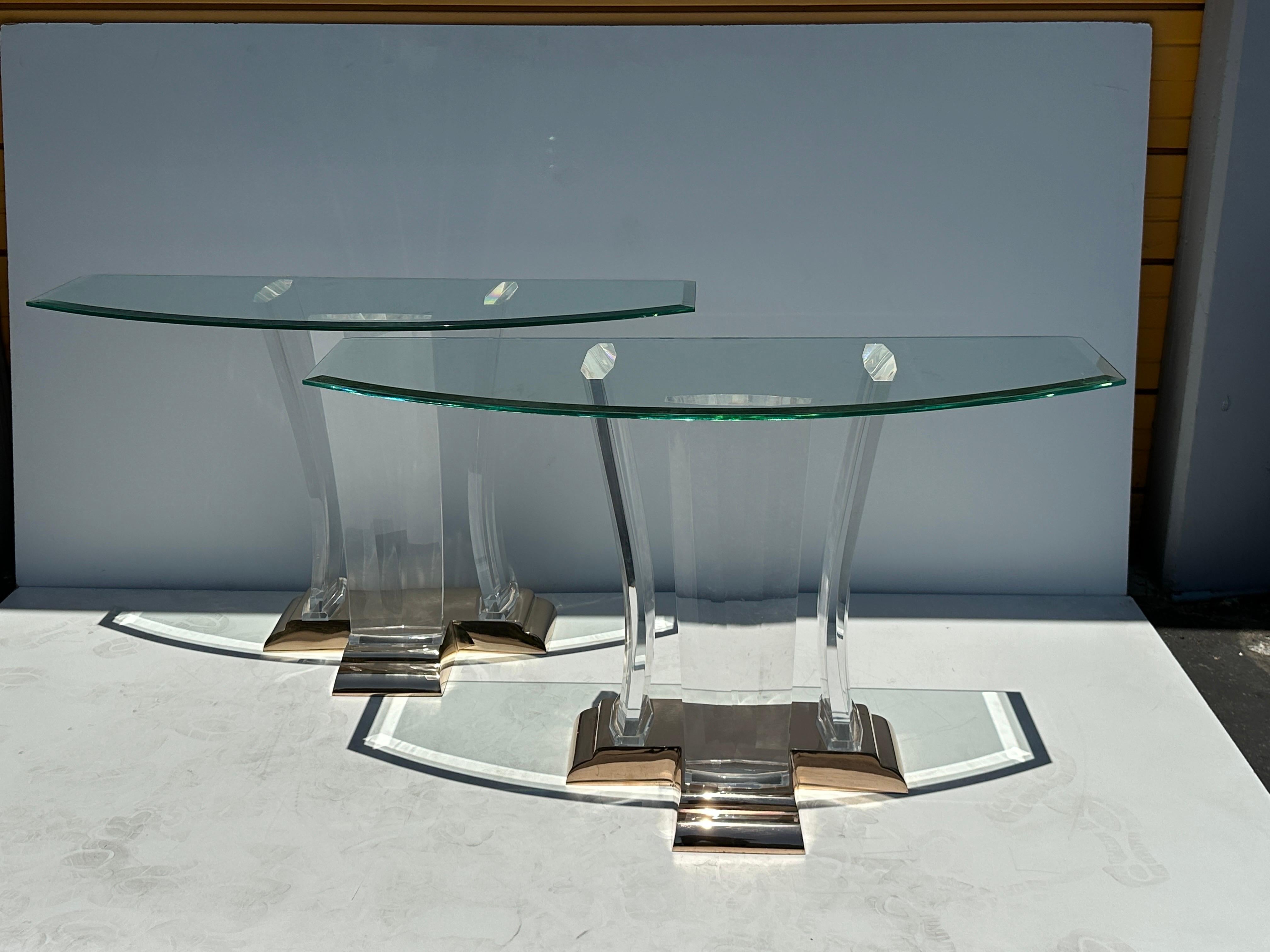Bronze / brass and polished Lucite console table attributed to Jeffrey Bigelow.
Two tables available. Two bases can also be used as a dining table with large glass top.