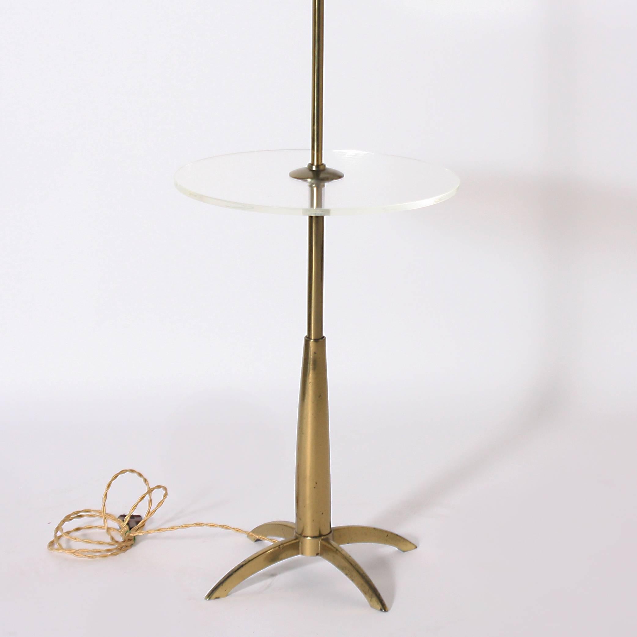Brass and Lucite Stiffel floor lamp, circa 1960.

Measures: 18