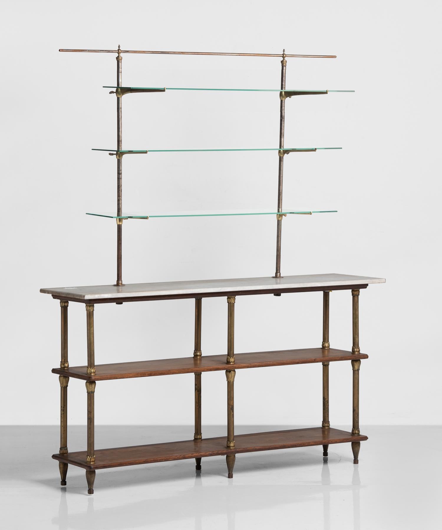 Brass and mahogany display shelving, England, circa 1920

Includes a marble top and brass, wood and glass elements allowing for a variety of display.