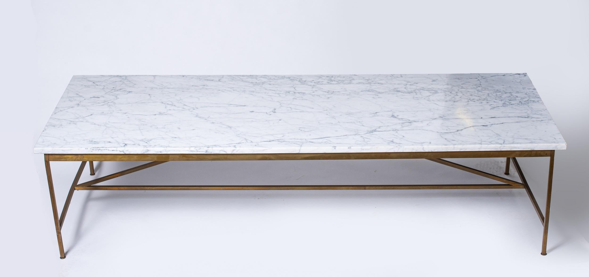 Large coffee table by American designer Paul McCobb, Directional edition.
Structure in square brass tubes. Top in white Carrara marble.
The four legs are fitted with small adjustable glides.

Biography

Paul McCobb ( 1917-1969)

Paul McCobb made his