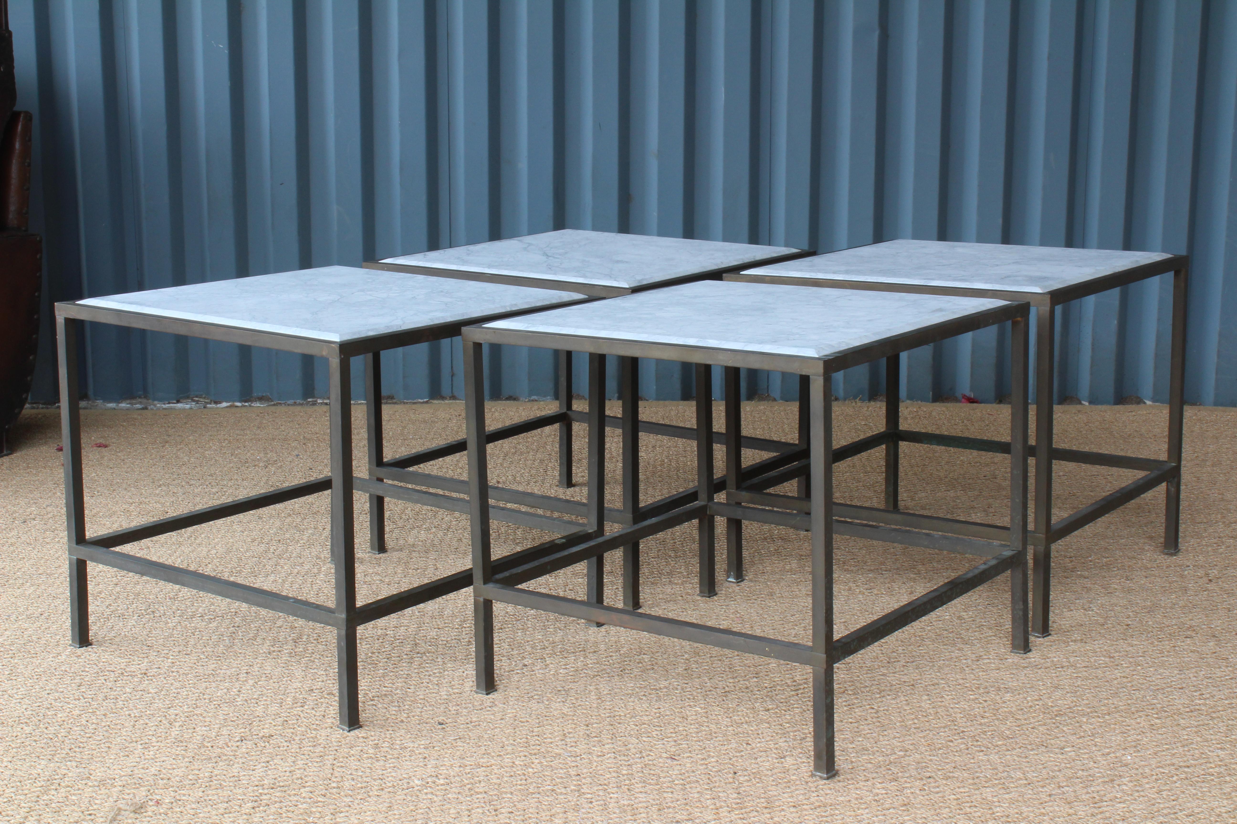 Brass framed modern end tables with a new custom cut marble tops. In the manner of Maison Jansen. Sold as pairs. Brass has a beautifully aged patina.