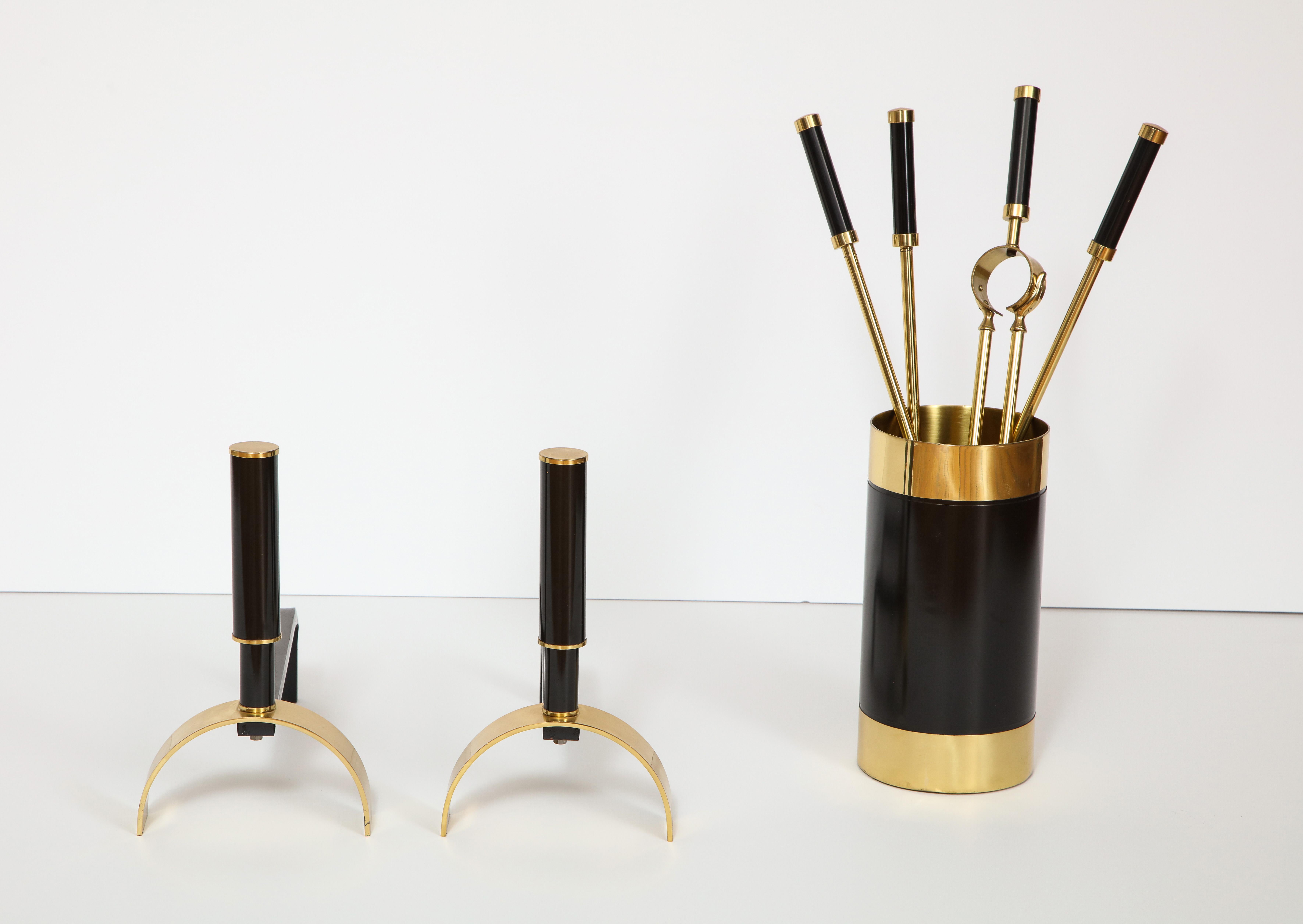 Mid-Century Modern brass and black enameled steel fireplace set which includes andirons, tools and Stand attributed to Giovanni Banci. Designed in Florence, Italy, circa 1970. Very modern and clean lines. On display at The Gallery at 200 Lex (at the