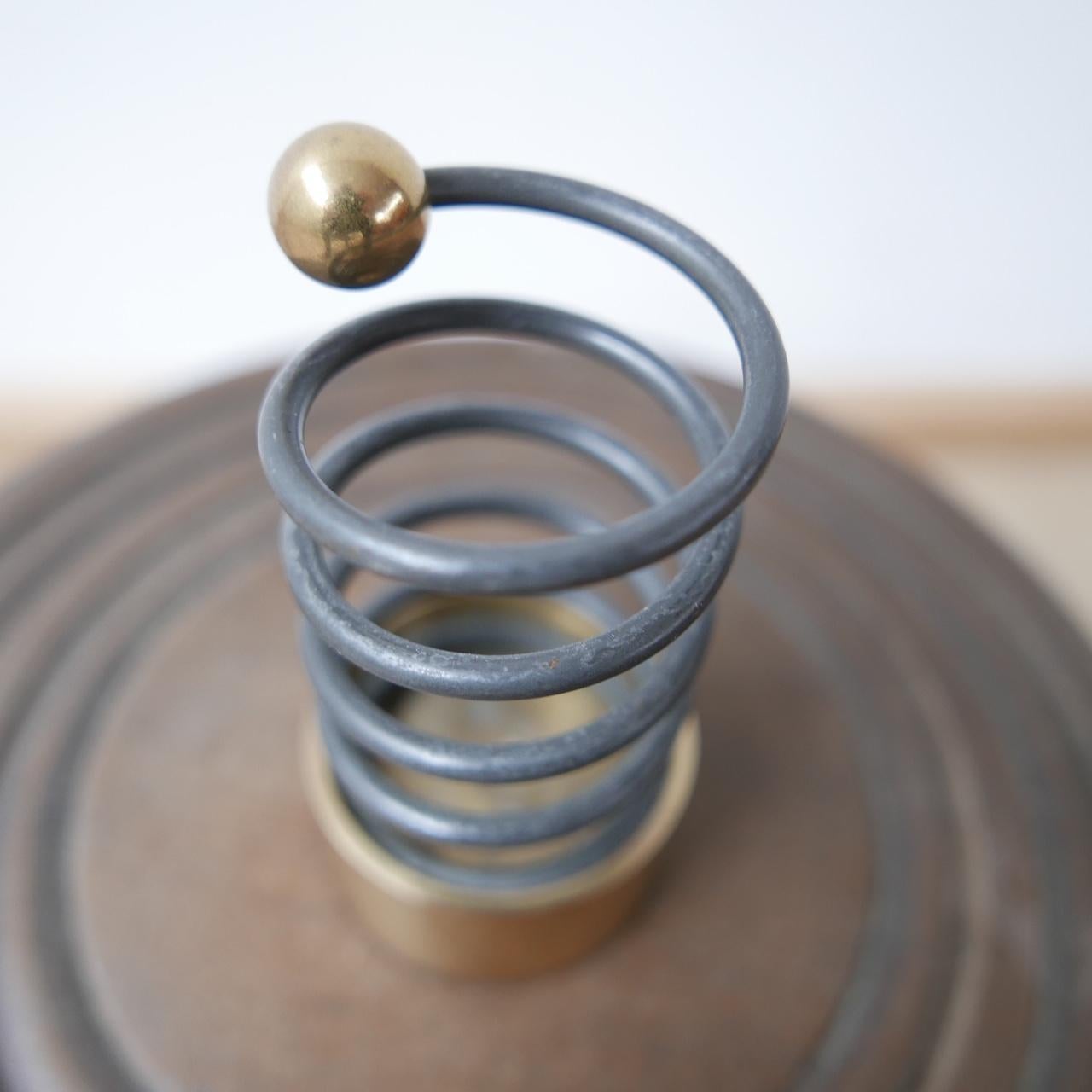 A stylish swivel candlestick. 

Sweden, c1960s. 

Solid brass and metal. 

Perfect for a desktop or mantelpiece. 

Very sculptural. 

Stamped Eskilstuna to base.

Dimensions: 10 Height x 5 Diameter in cm.

Delivery: POA.

 