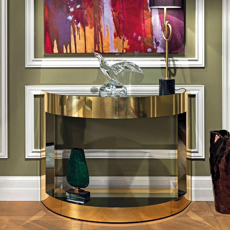 Effortlessly adorning both contemporary and classic interiors of refined character, especially if topped with a sumptuous mirror or prized picture, this gorgeous console features a clean profile of utmost elegance. Entirely handcrafted of brass,