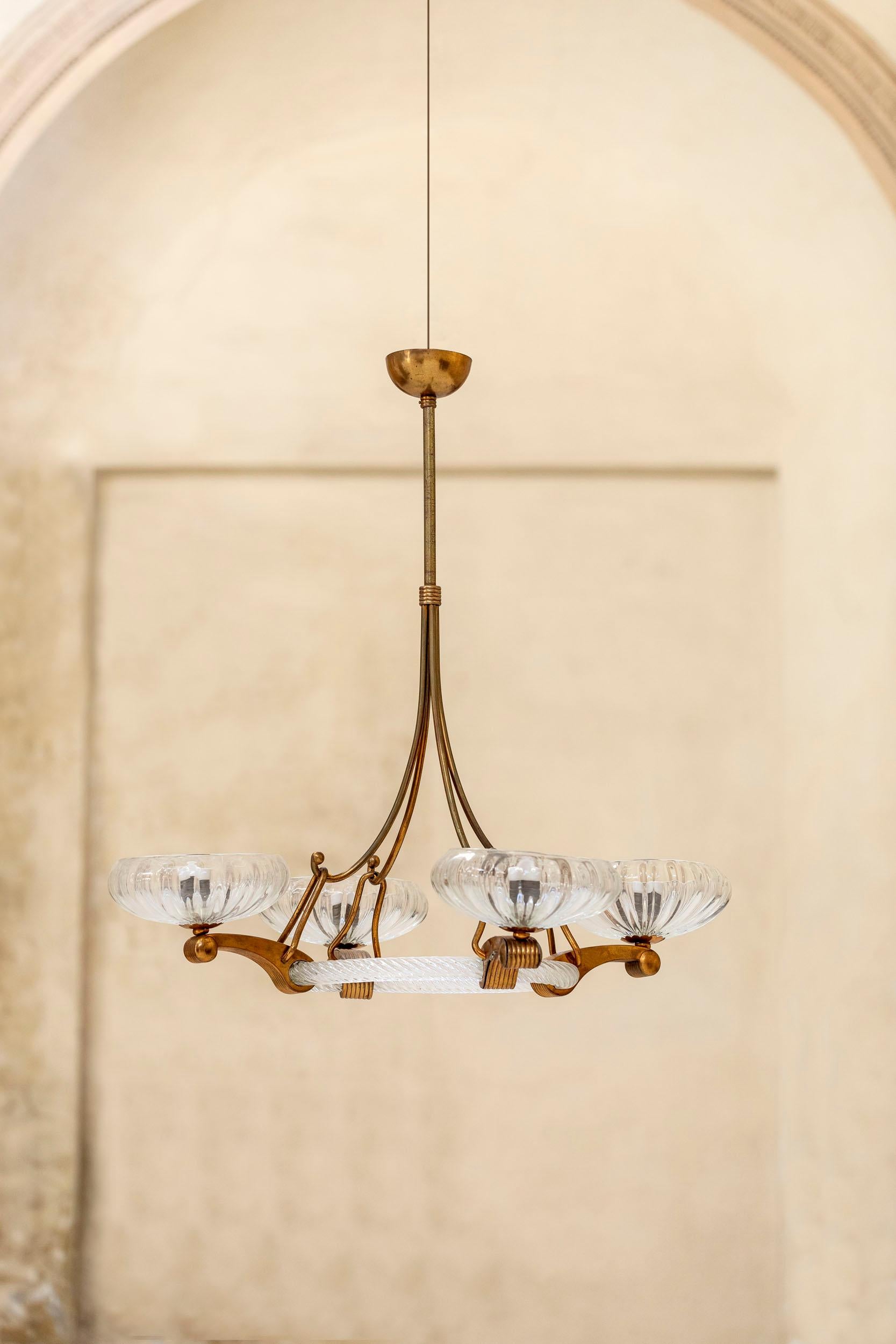 Stunning brass and Murano chandelier attributed to Barovier.
Hand blown Murano glass with rare brass details. Four lights.