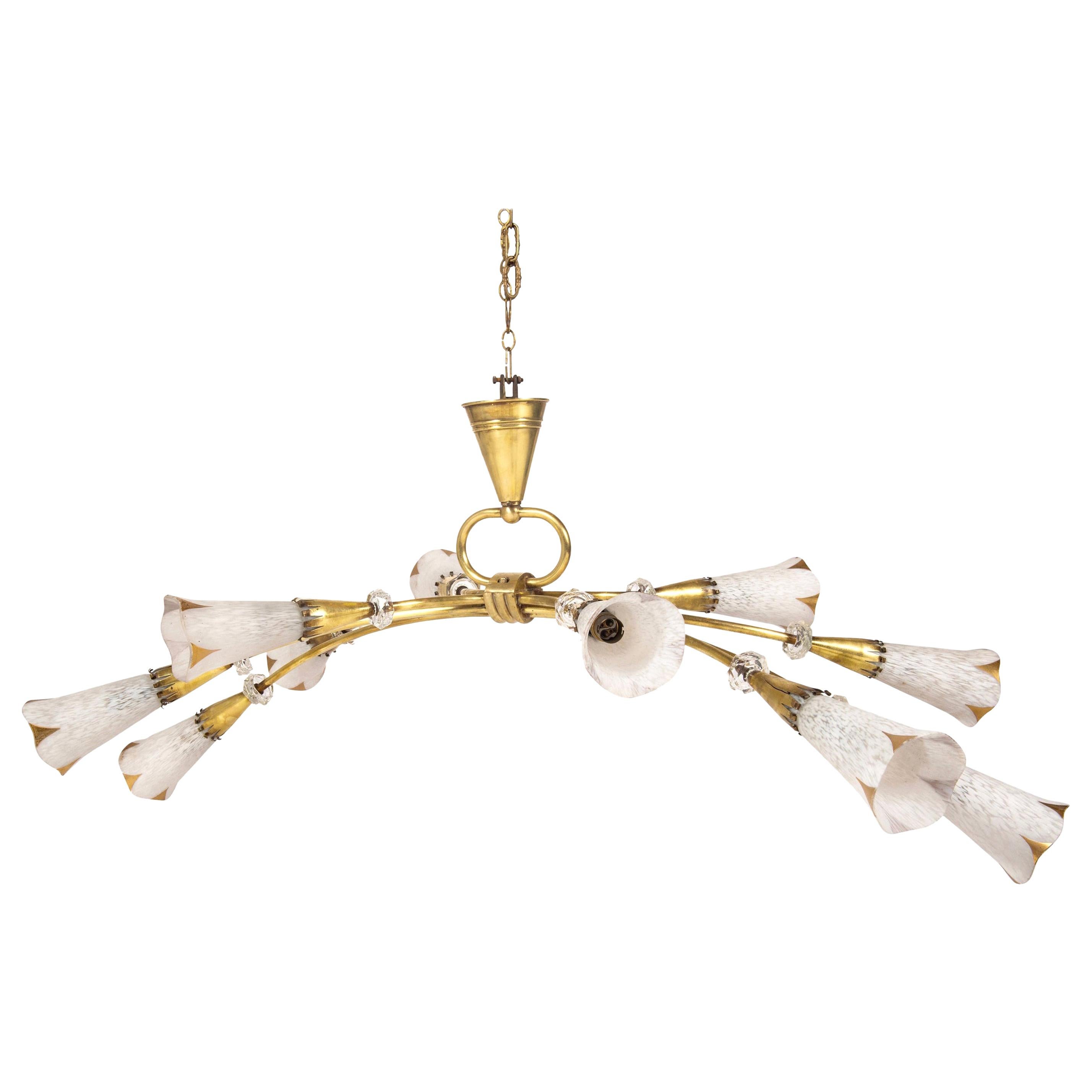A 1960s Italian ten-arm spray chandelier with hand blown mottled white glass shades and faceted glass cuff detailing, newly electrified.
 