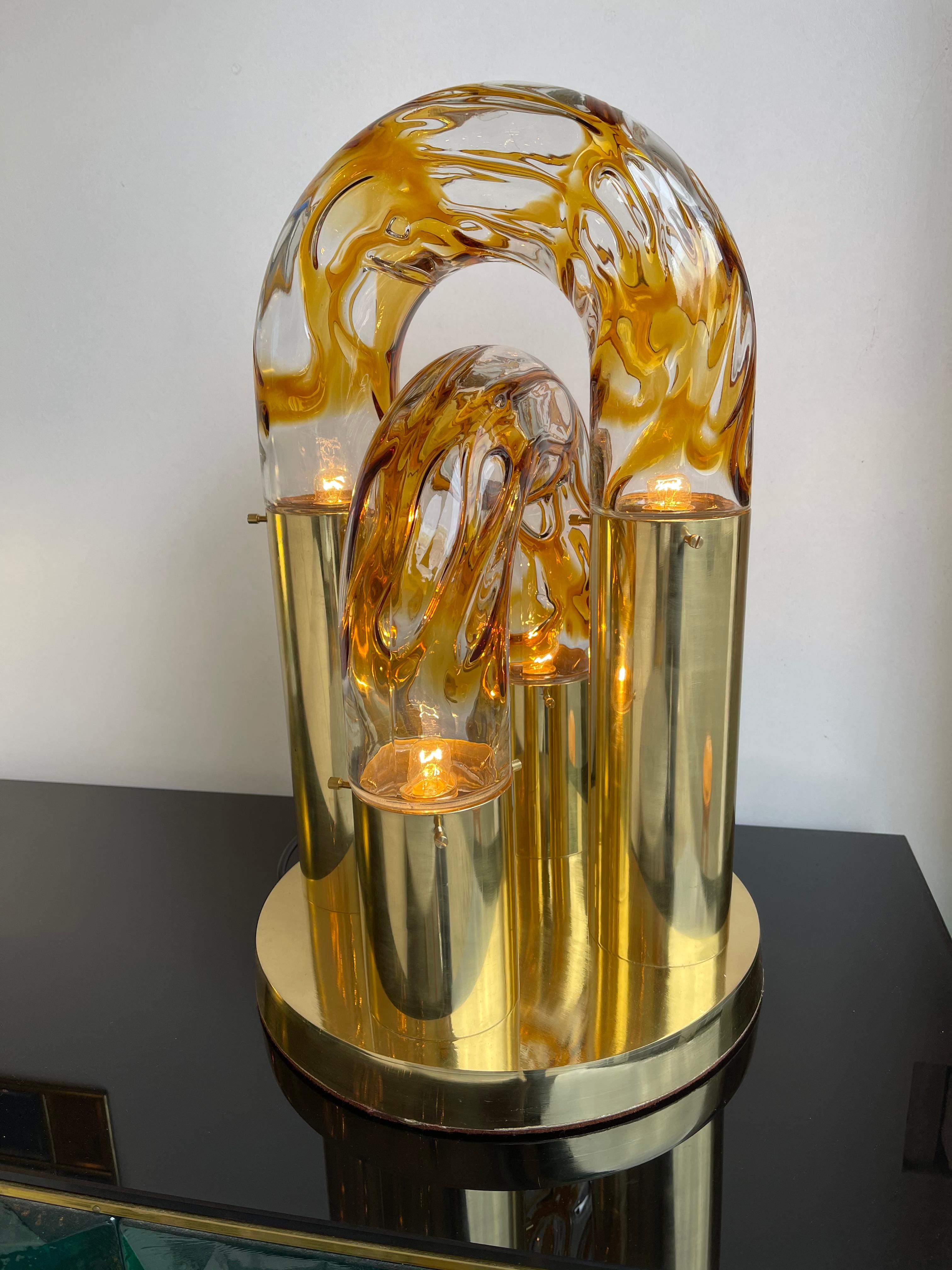 Table or desk lamp by the designer Aldo Nason for the manufacture Mazzega Murano. Amber blown glass, brass base. Famous manufacture like Venini, Vistosi, La Murrina, VeArt, Carlo Nason, Poliarte.