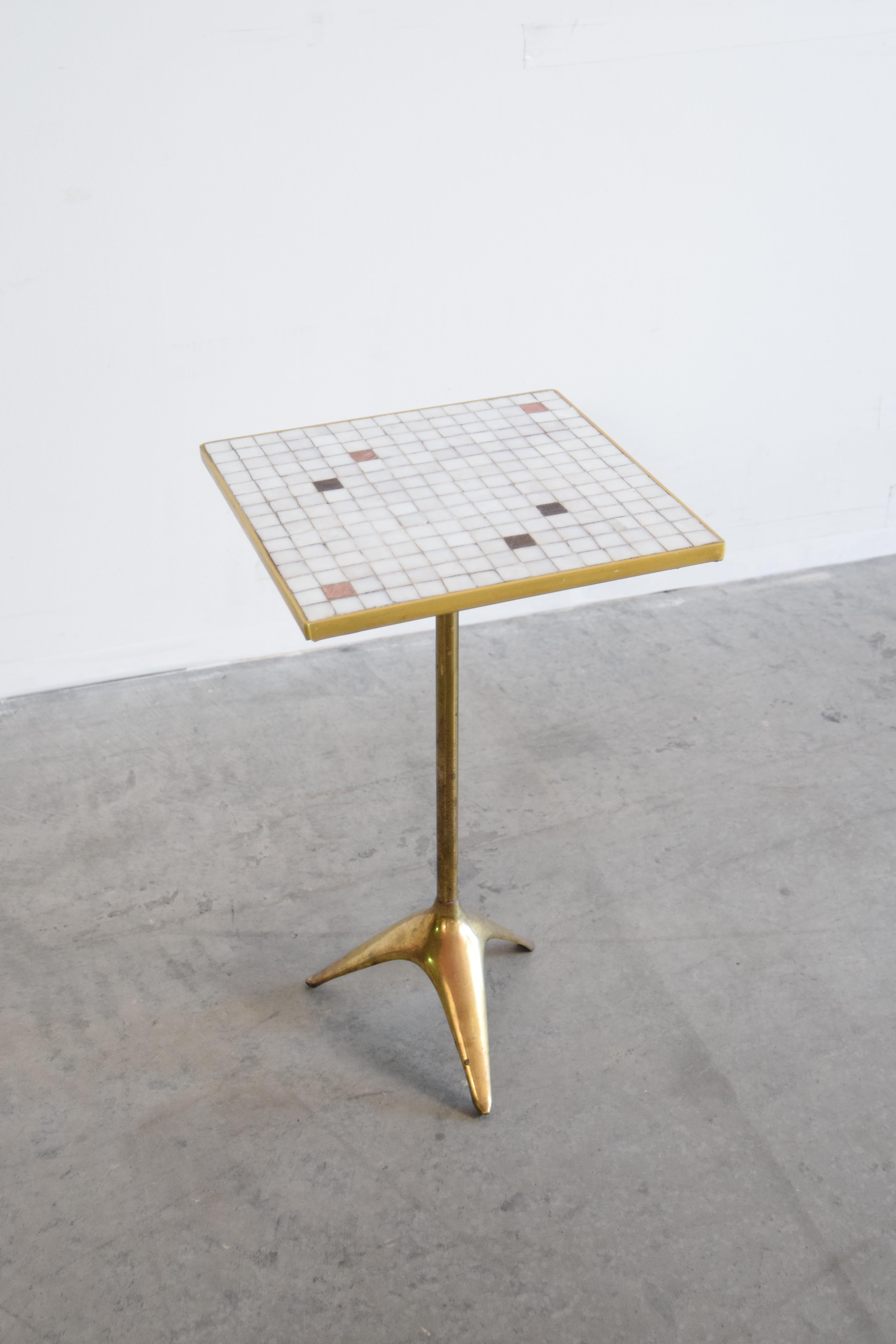 Brass and Murano glass tile top table, designed by Ben Seibel (1918 - 1985), circa 1966. 

Ben Seibel was an American industrial designed particularly known for his tableware. He began his studies in architecture at Columbia University, where he