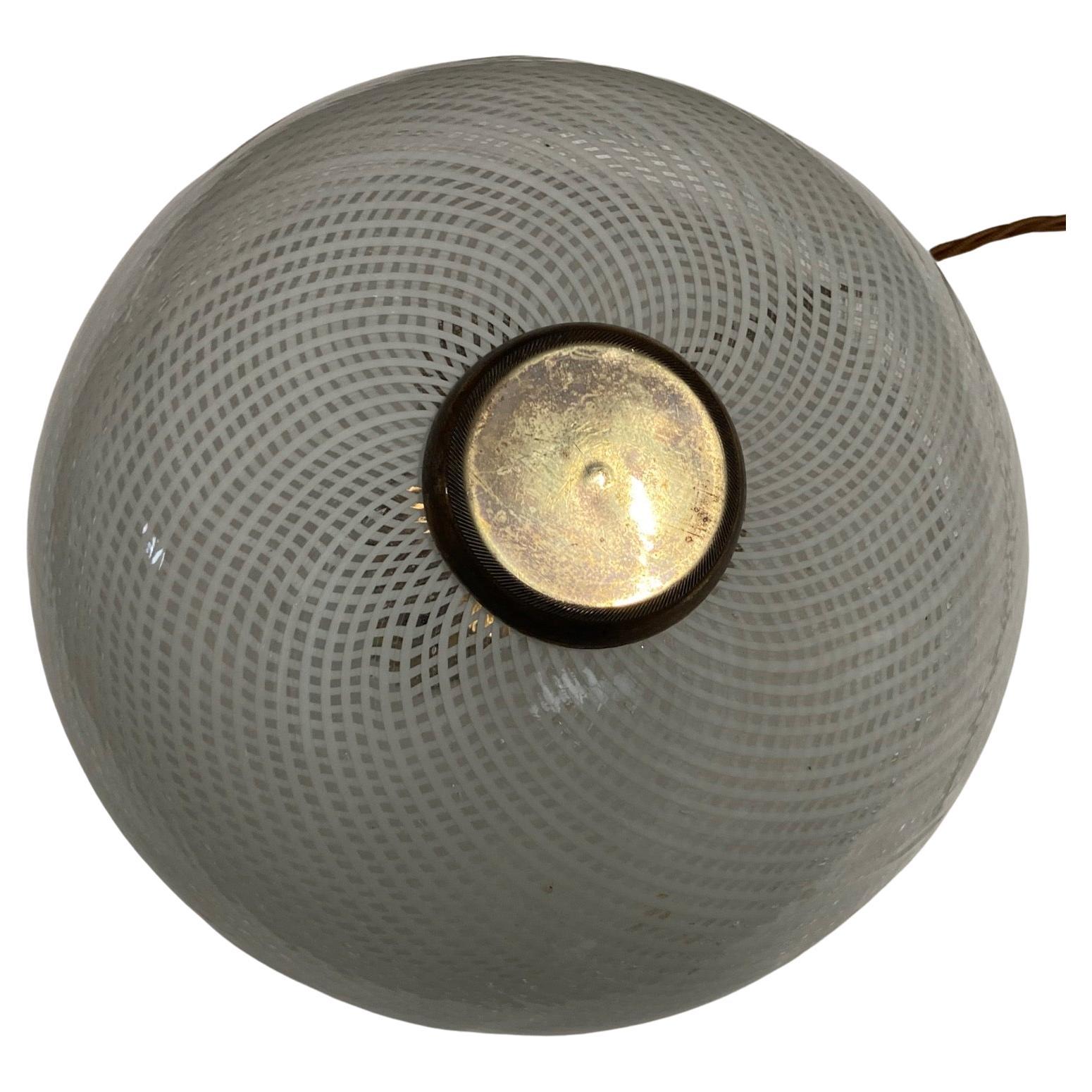 1930's to 50's brass and Murano Reticello glass, flush mount ceiling light. It is most probably by Venini. It is an old hand blown piece and feels very organic and 