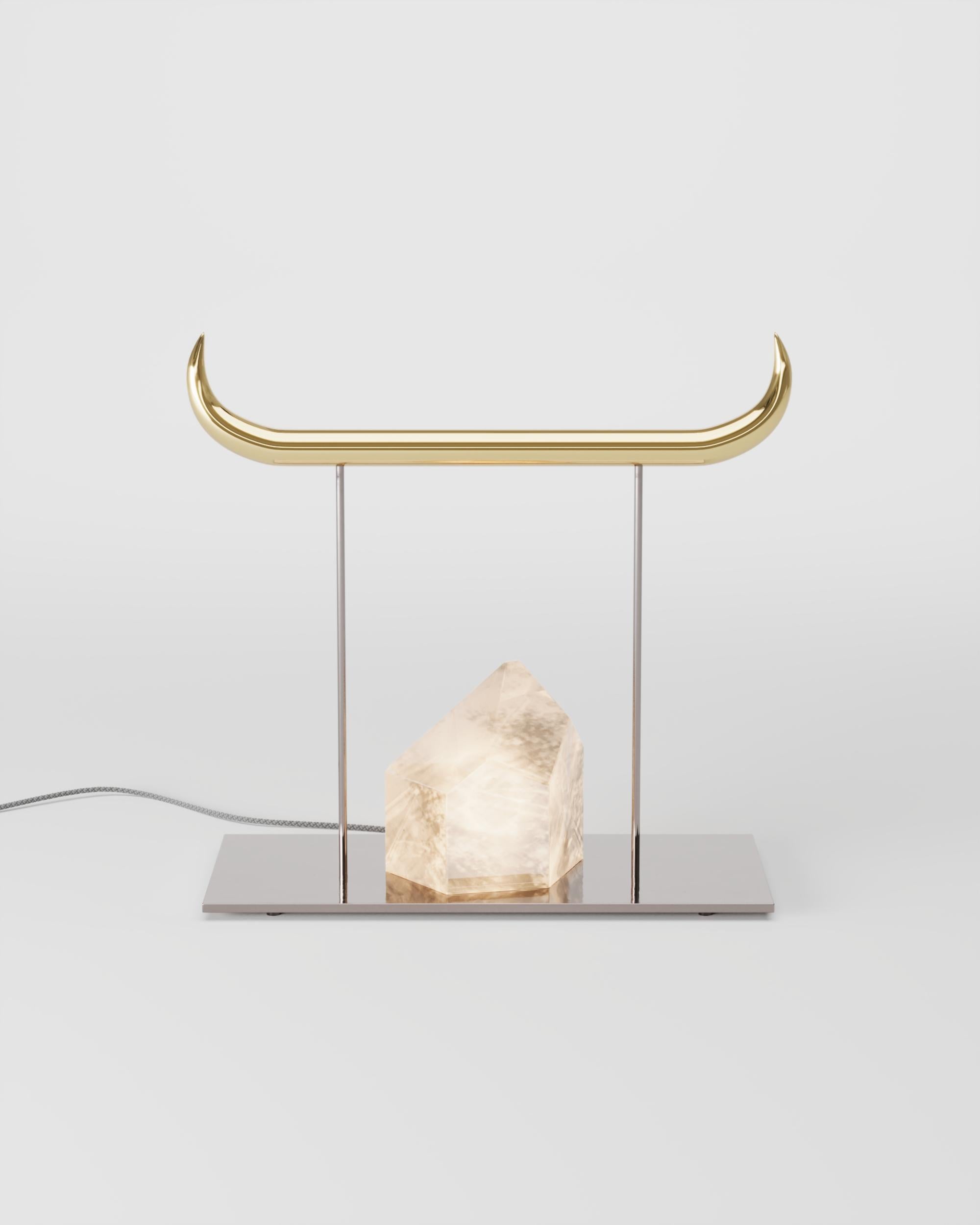 Brass and Nickel Minotauro Table Lamp by Studio Orth
Dimensions: W 61 x D 20 x H 56 cm
Materials: Cast metal, nickel-plated steel, and selenite stone
Finishes: Polished Cast Brass or Polished Cast Aluminum
 
All our lamps can be wired according to