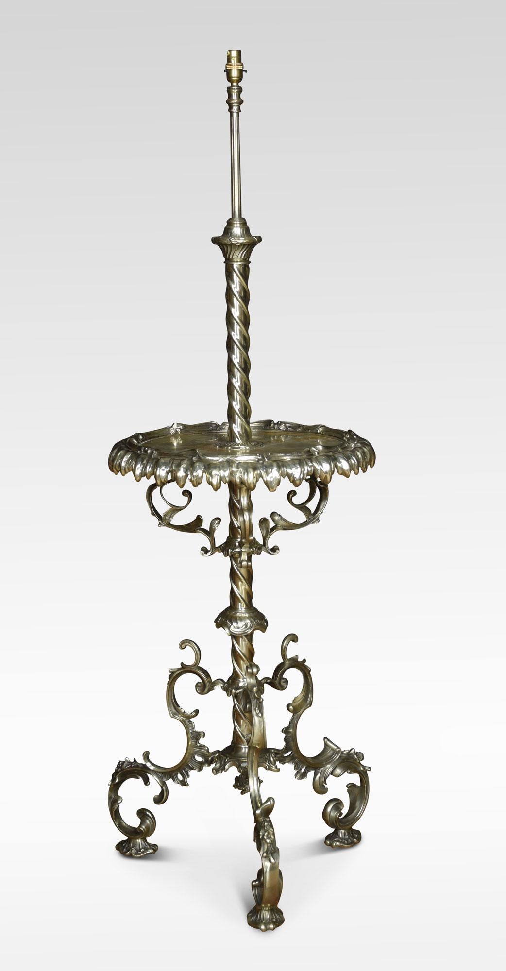 Rococo revival brass and onyx standard lamp table, the rope twist column supporting a circular onyx tabletop with a scrolling cast brass border. All raised upon three cast foliate supports.
Dimensions
Height 61 inches height with shade 67