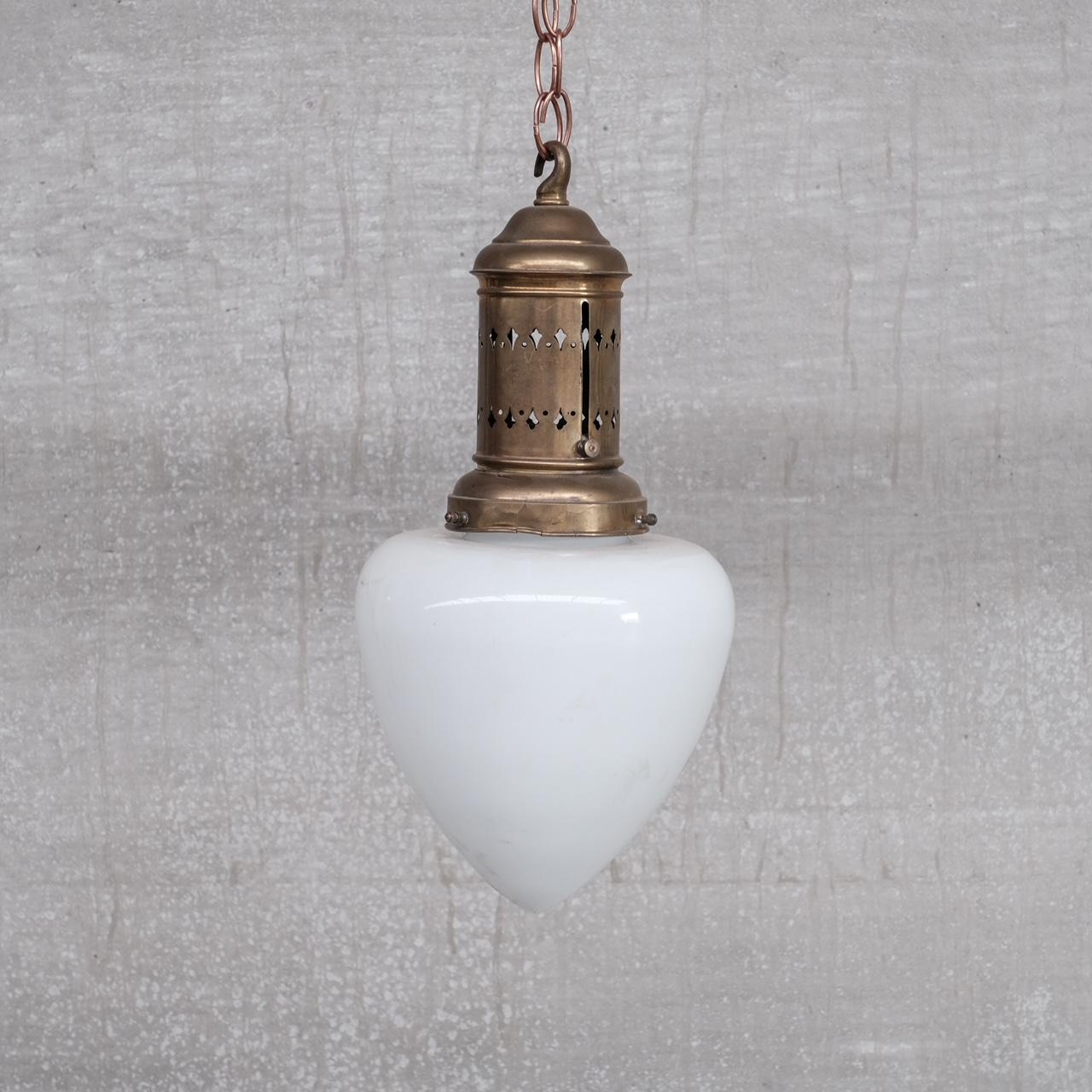 An elegant acorn pendant light. 

France, c1930s. 

Good quality brass gallery over an opaline glass shade. 

Since re-wired and PAT tested. 

No ceiling rose or chain was retained with the lights, they are easily sourced online.